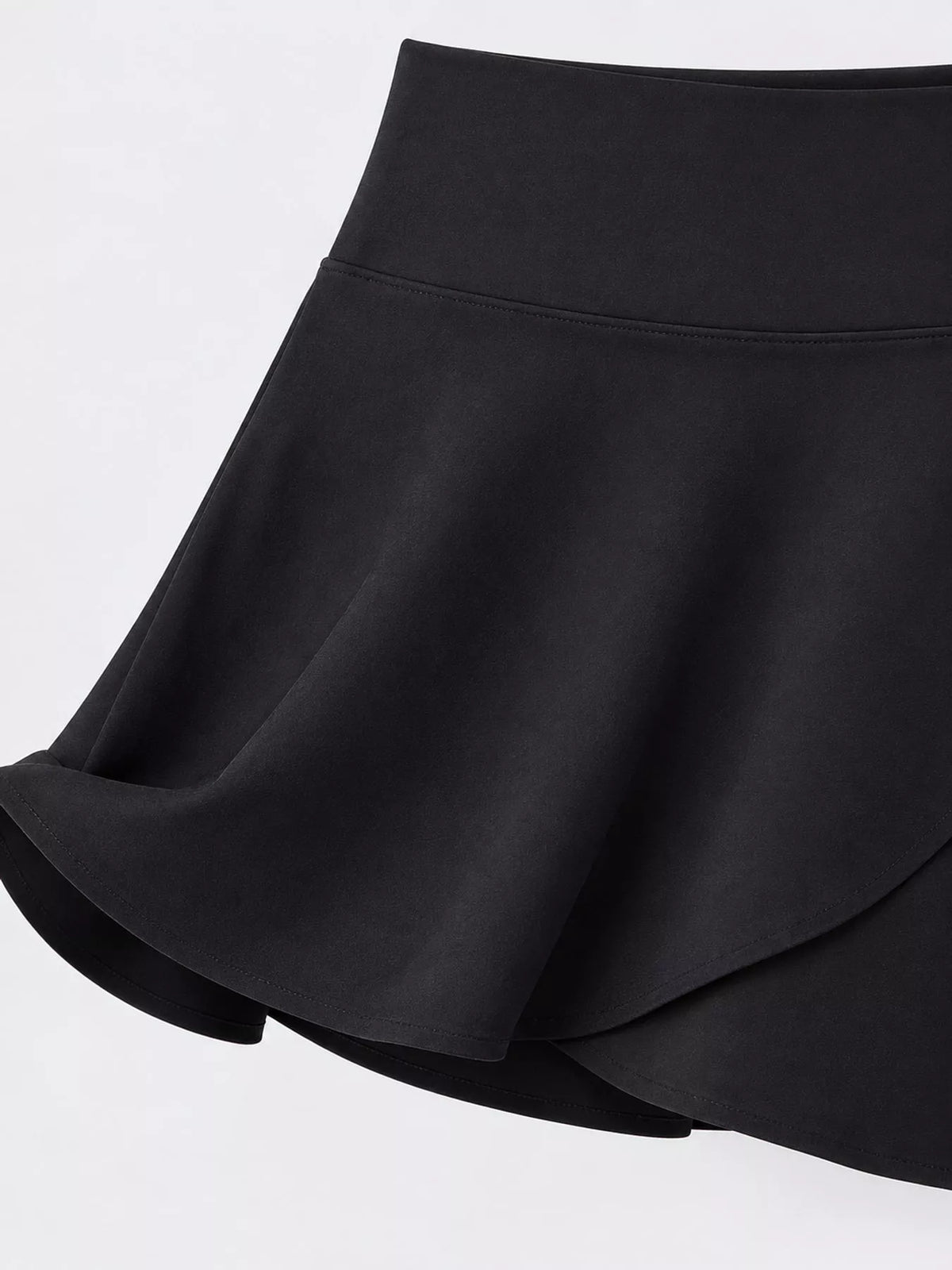 Black flared athletic skort, waistband and overlapping skirt front