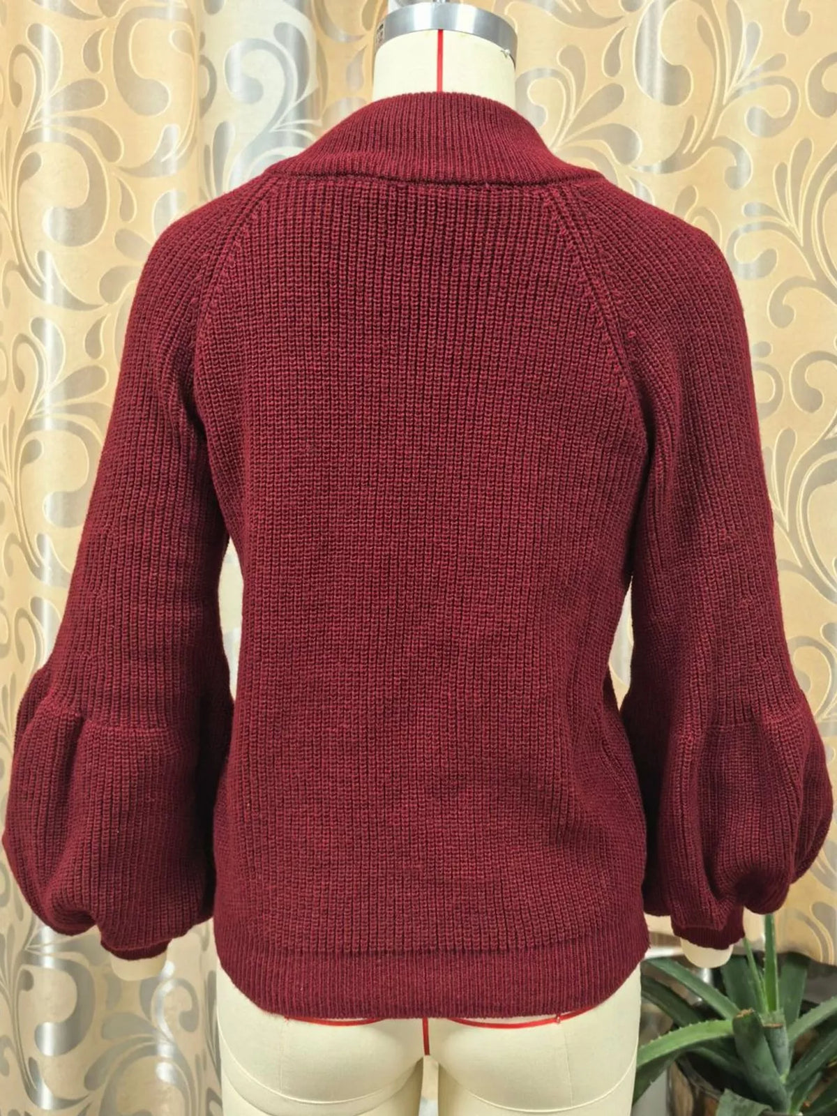 Burgundy ribbed knit zip-up lantern sleeve cardigan, back view