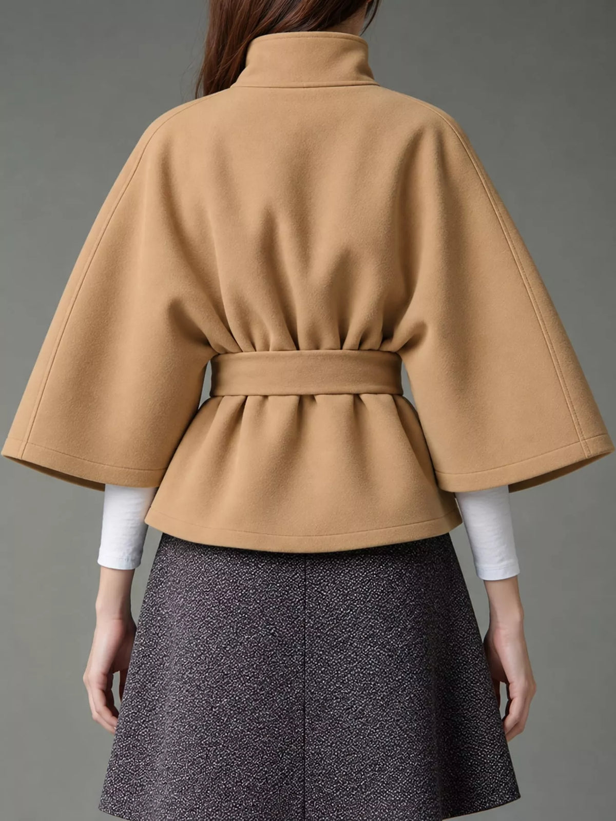 Tan belted button-front cape — back view