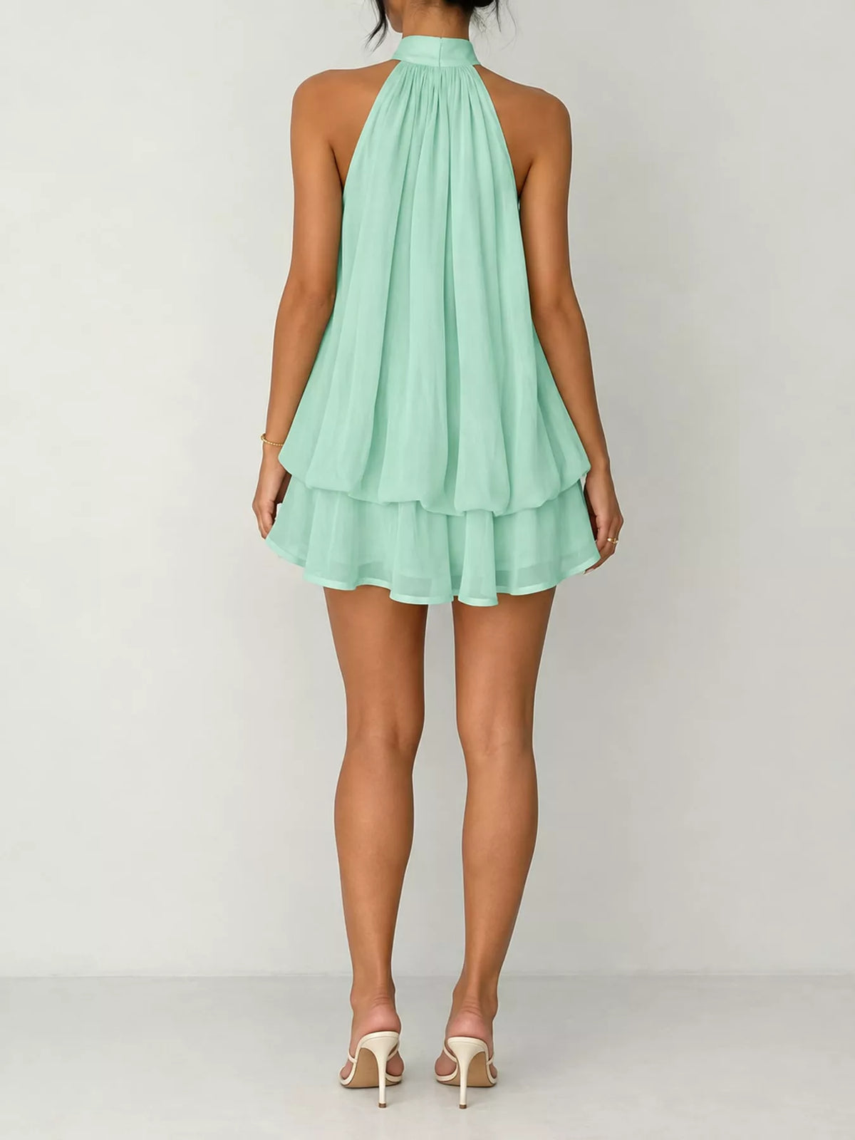 Mint green halter neck layered mini dress, back view