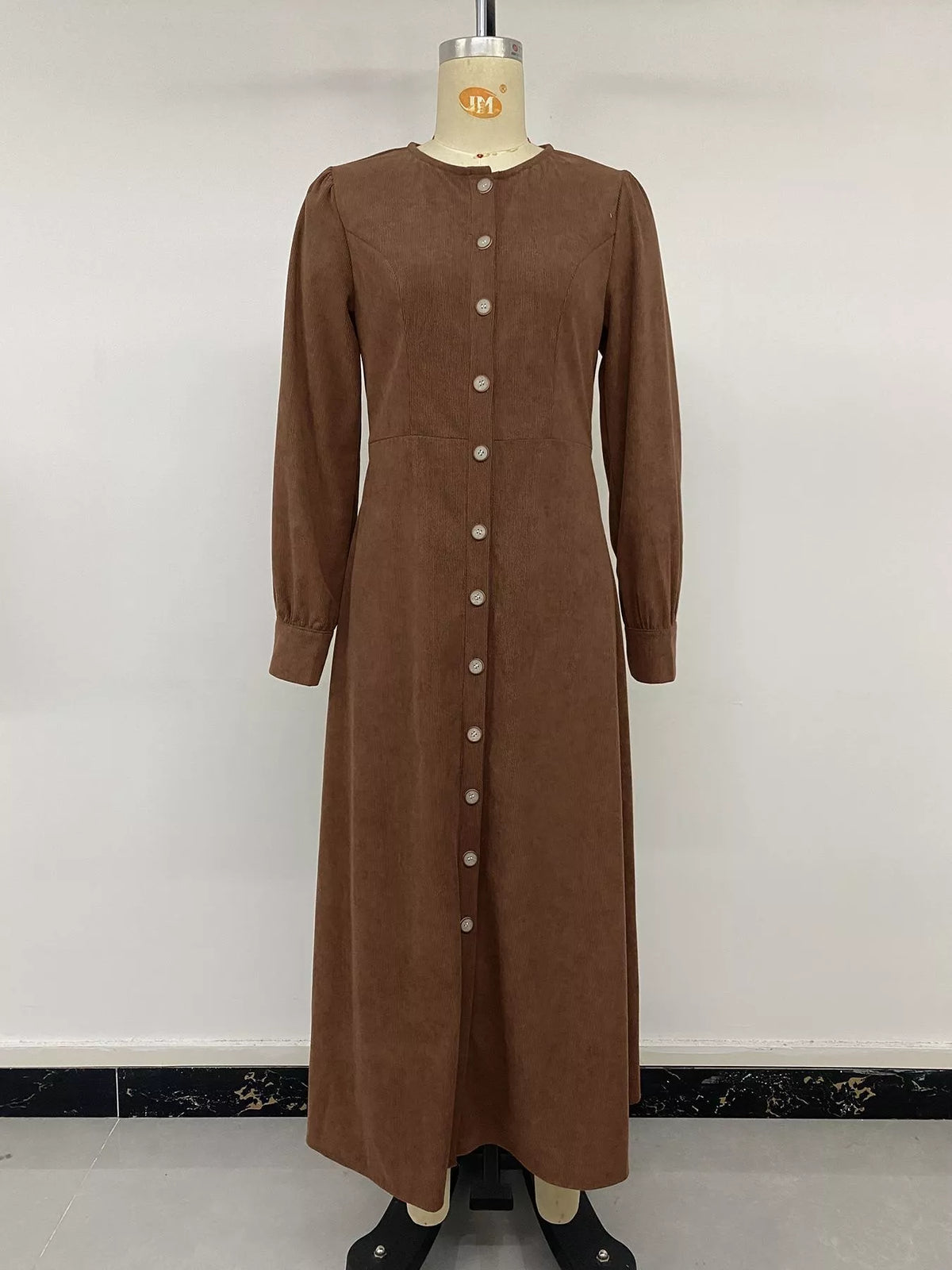Brown corduroy button-down maxi dress, front on mannequin