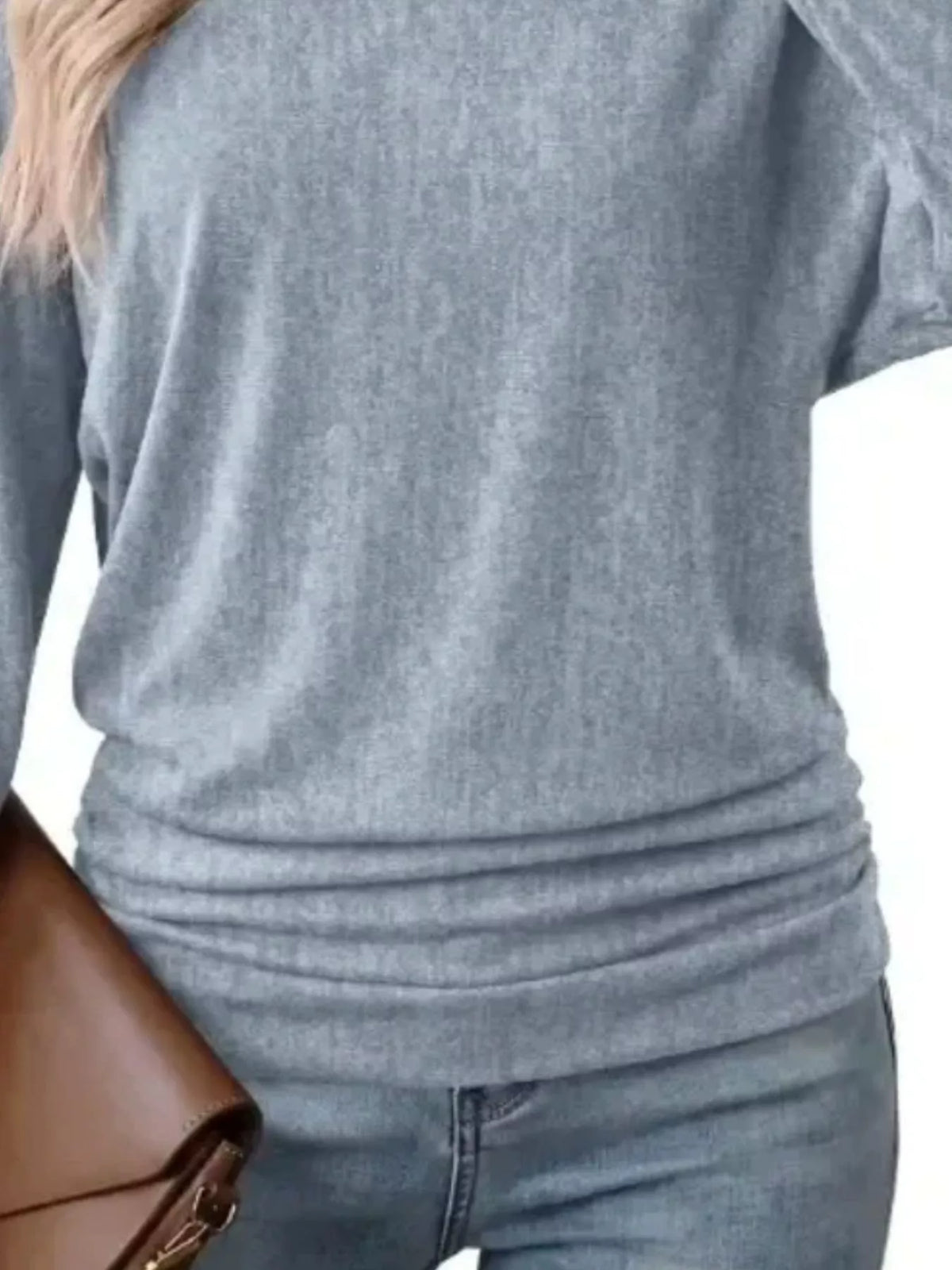 Light blue crew neck t-shirt with ruched hem, knit texture and gathered lower hem