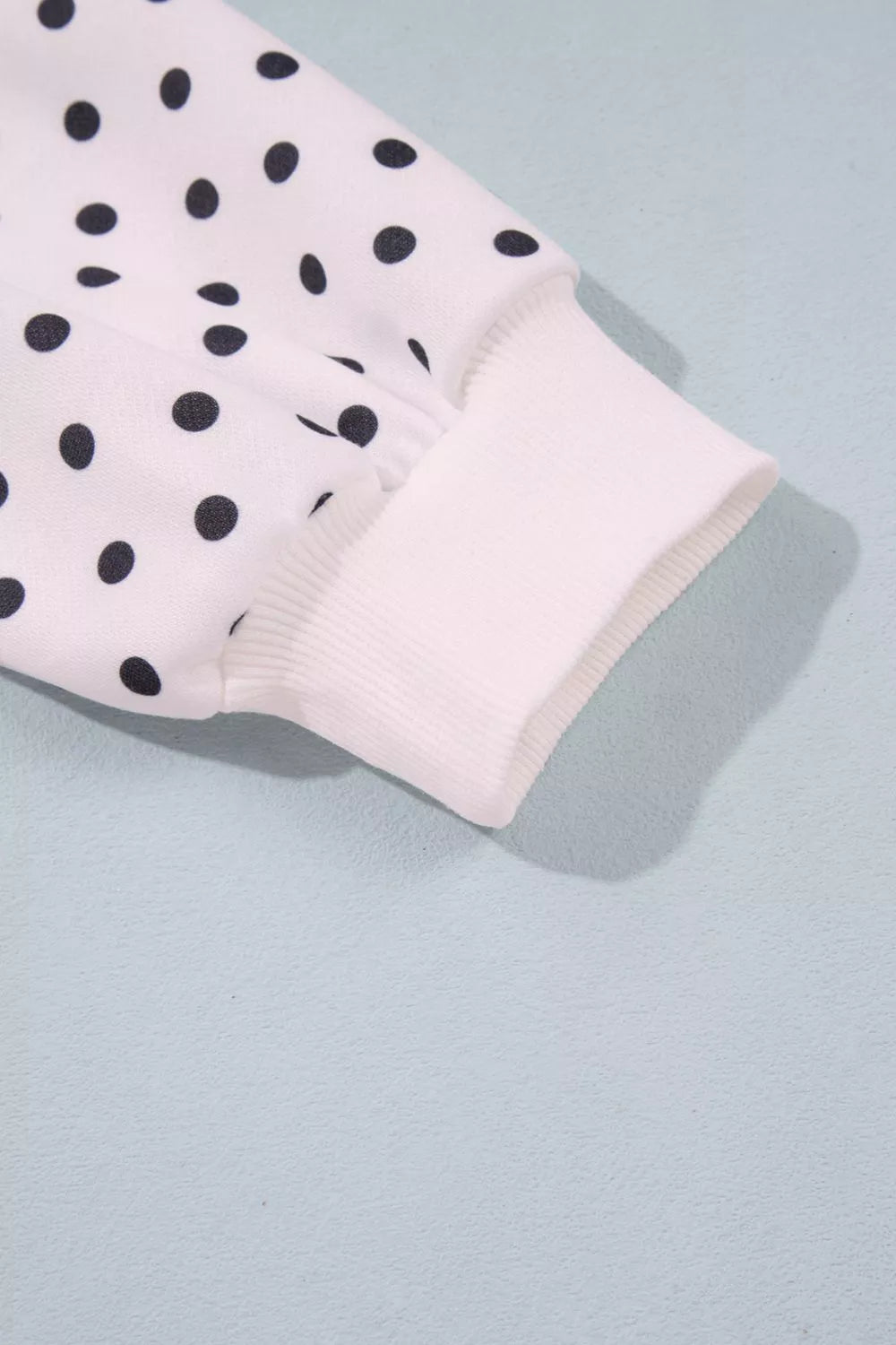 White polka dot mock neck sweatshirt