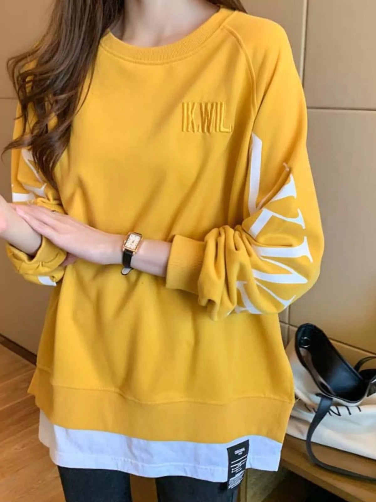 Yellow layered-hem sweatshirt with graphic sleeve detail