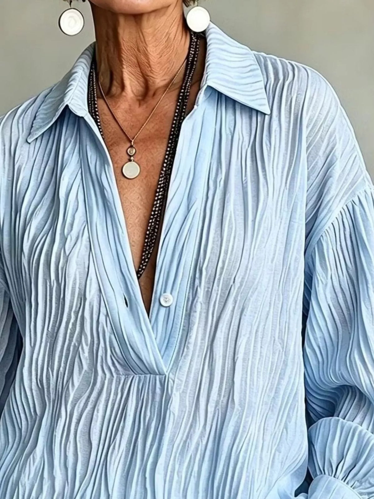Blue textured blouse, collared neckline and textured front