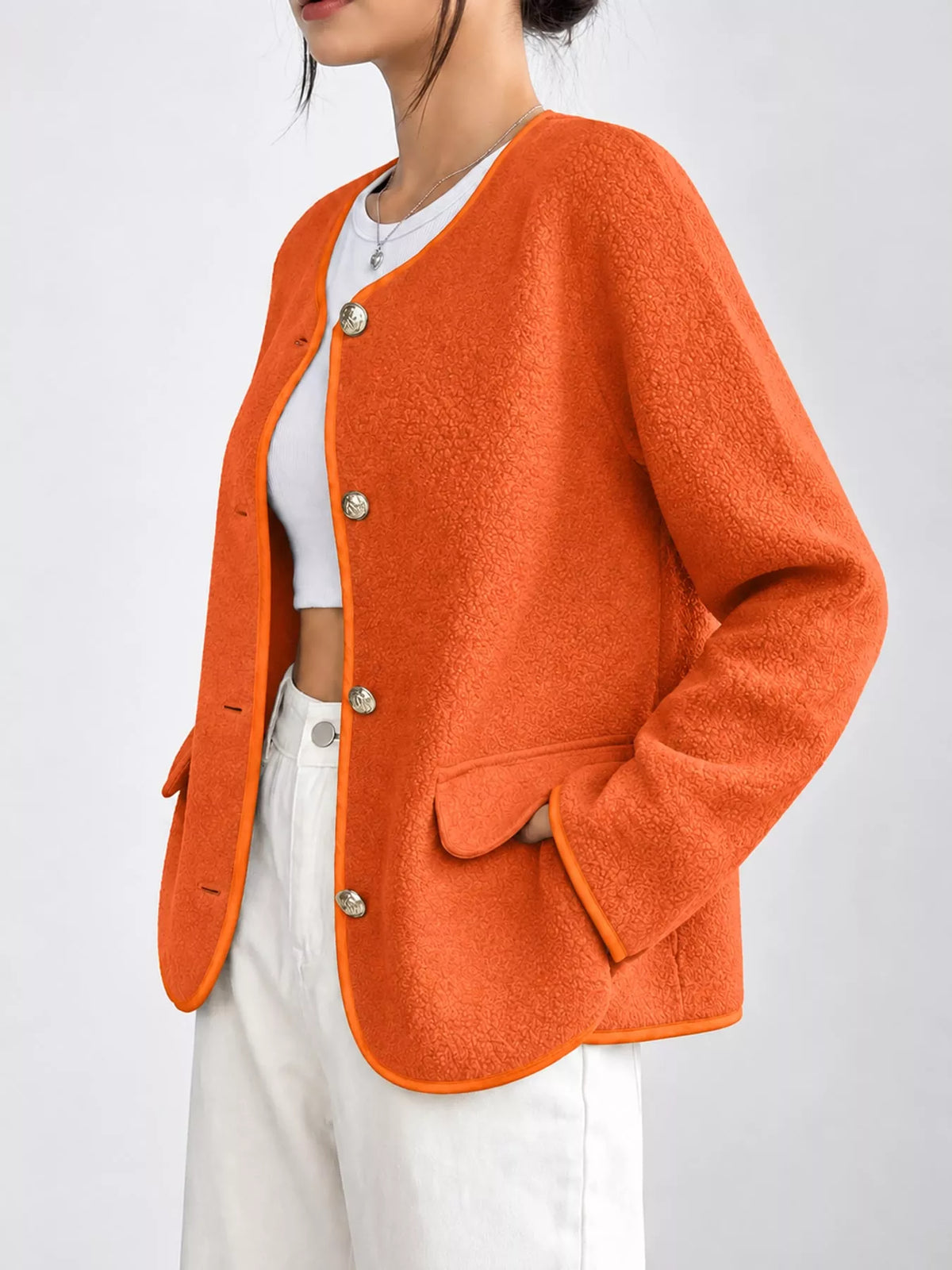 Orange textured button-front jacket — side view