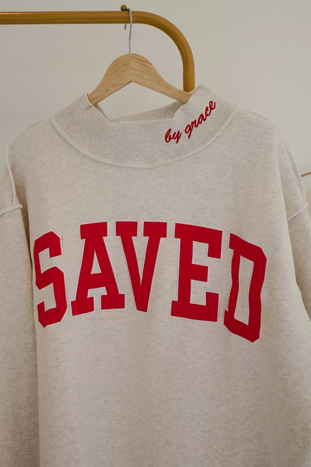 Light Gray SAVED Letter Graphic Crew Neck Sweatshirt front view on hanger