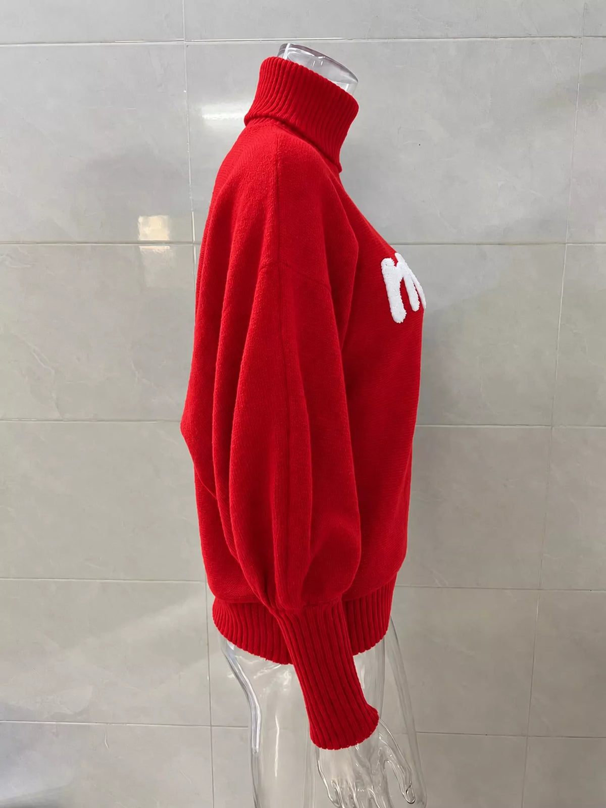 Red lettering turtleneck sweater