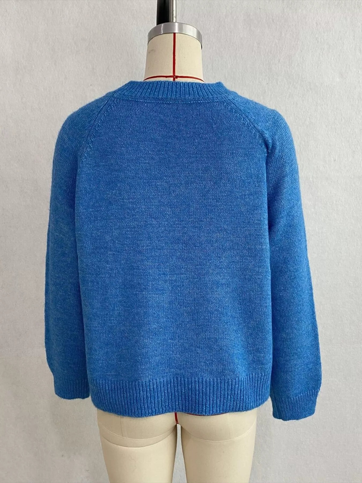 Floral embroidered round-neck sweater in blue, back mannequin view
