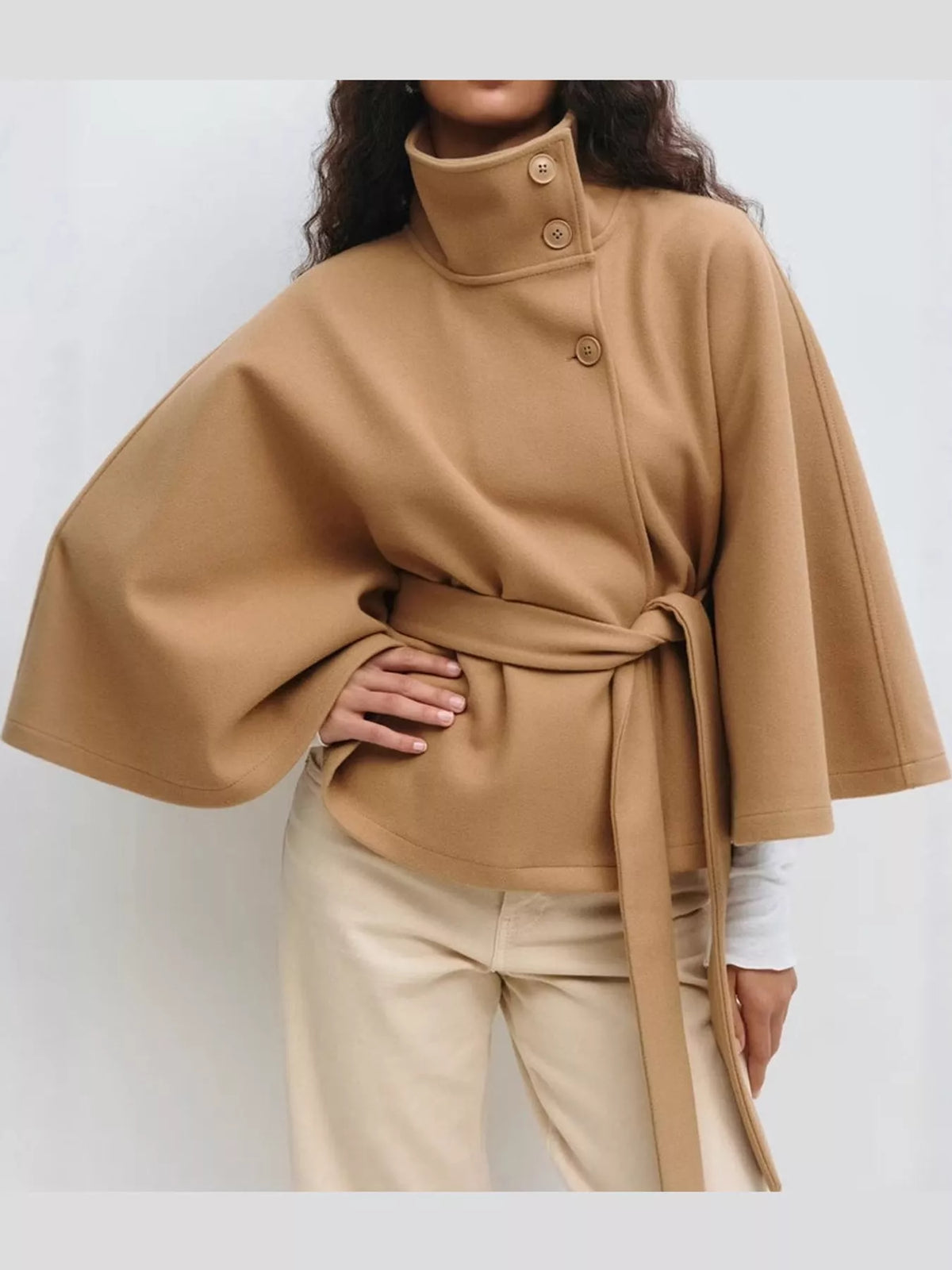 Tan belted button-front cape — front view