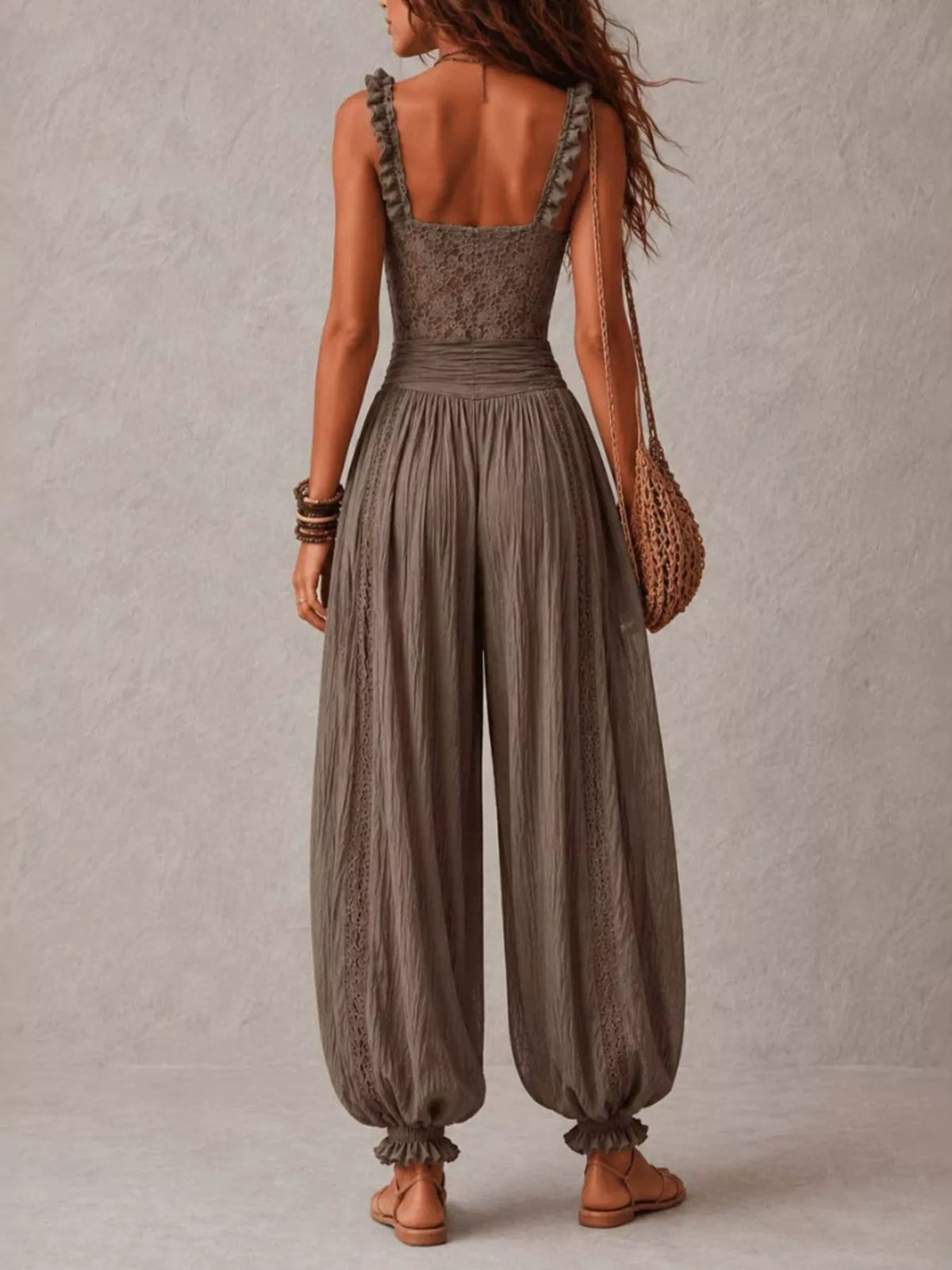 Taupe lace-bodice harem-leg jumpsuit, full back view.