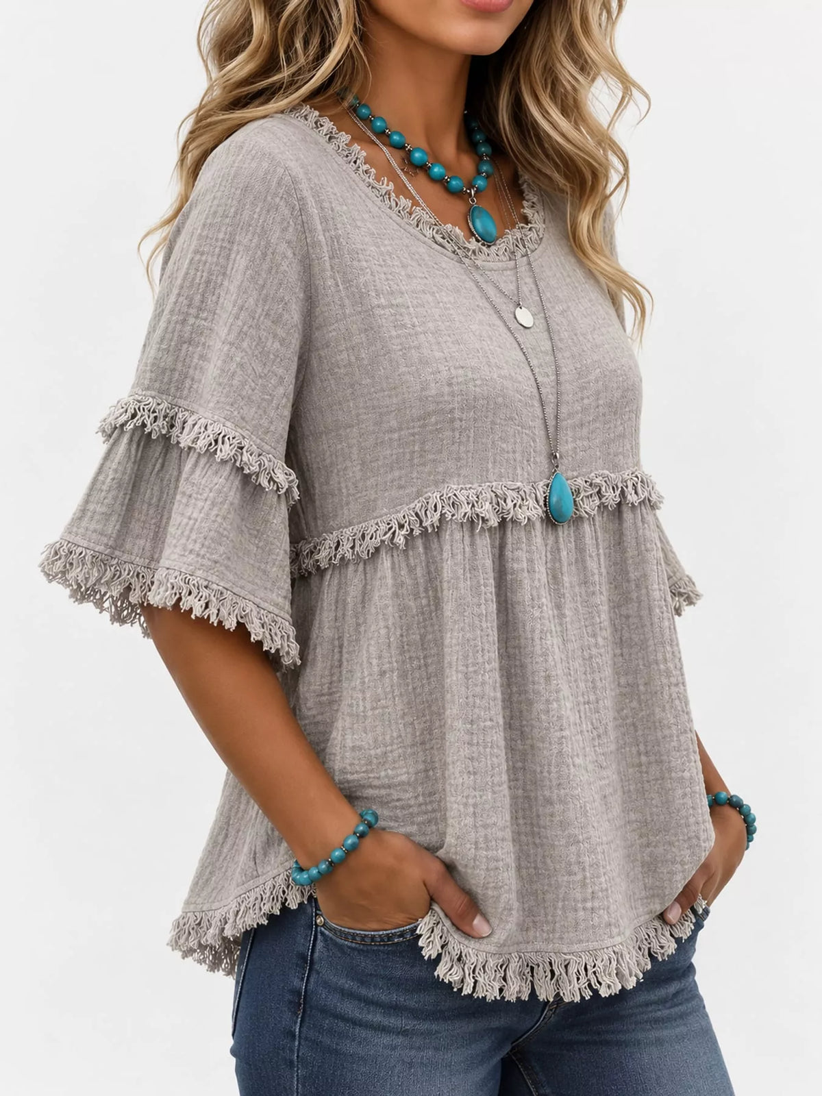 Gray frayed edge textured blouse, side view