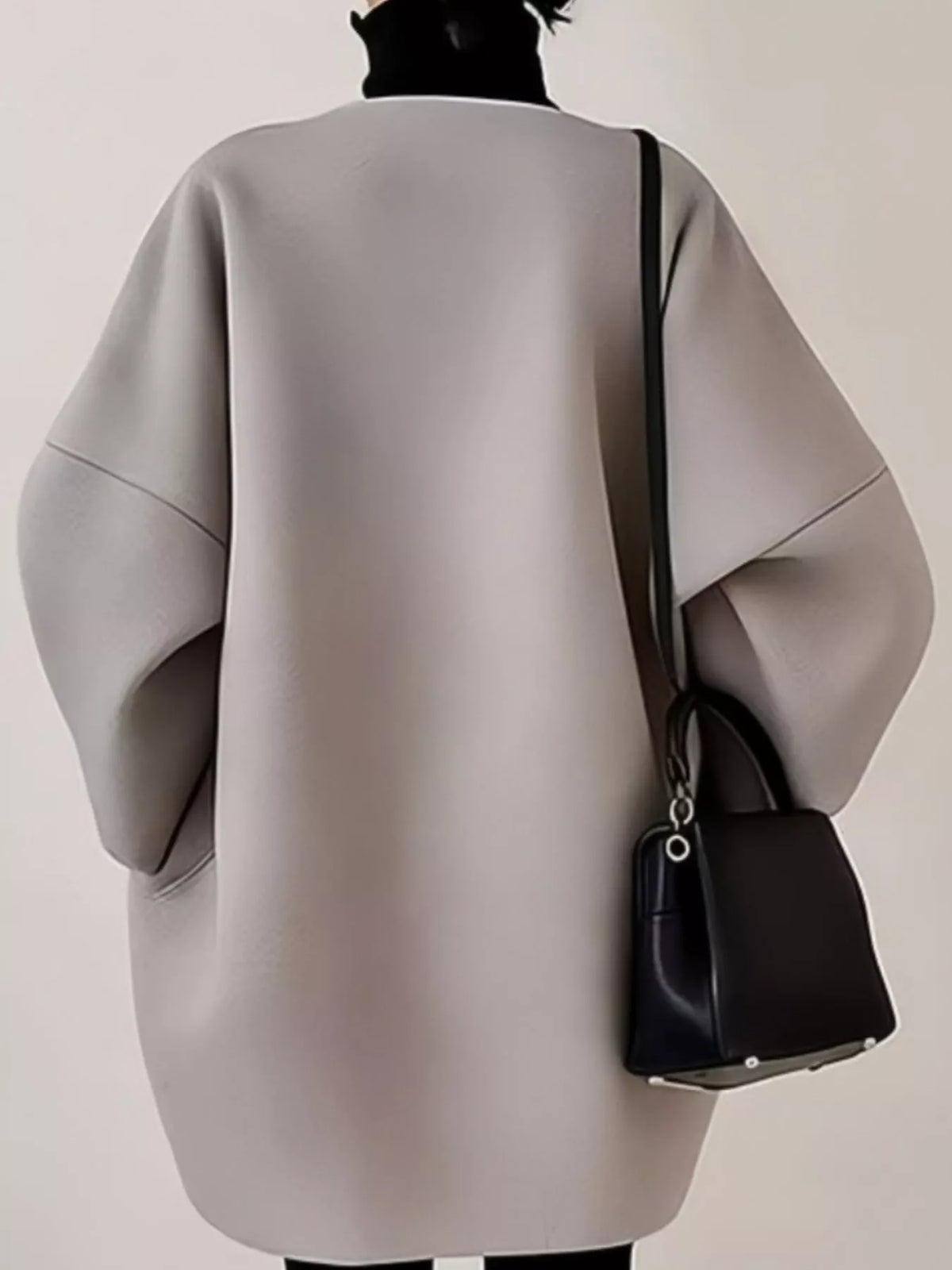 Silver oversized scuba-style coat, back view