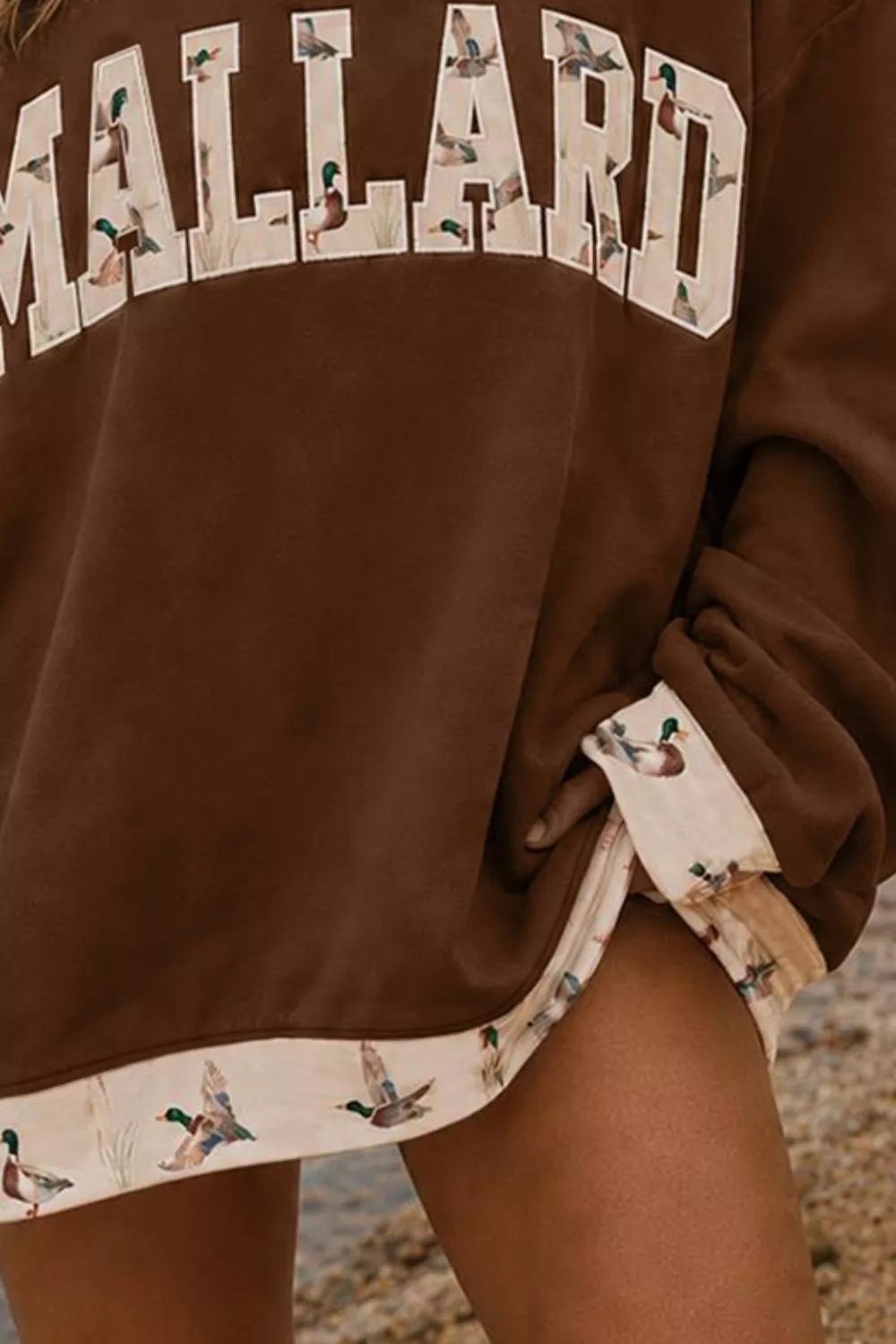 Brown MALLARD graphic sweatshirt, cuff and hem detail