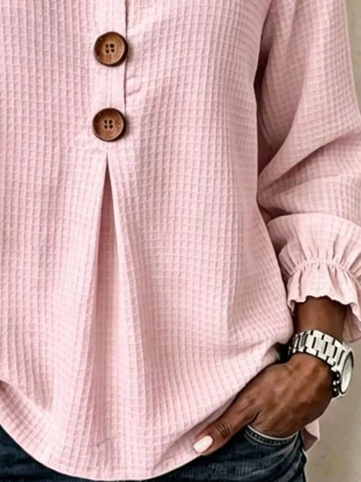 Pink waffle knit blouse, waffle texture and flounce cuff