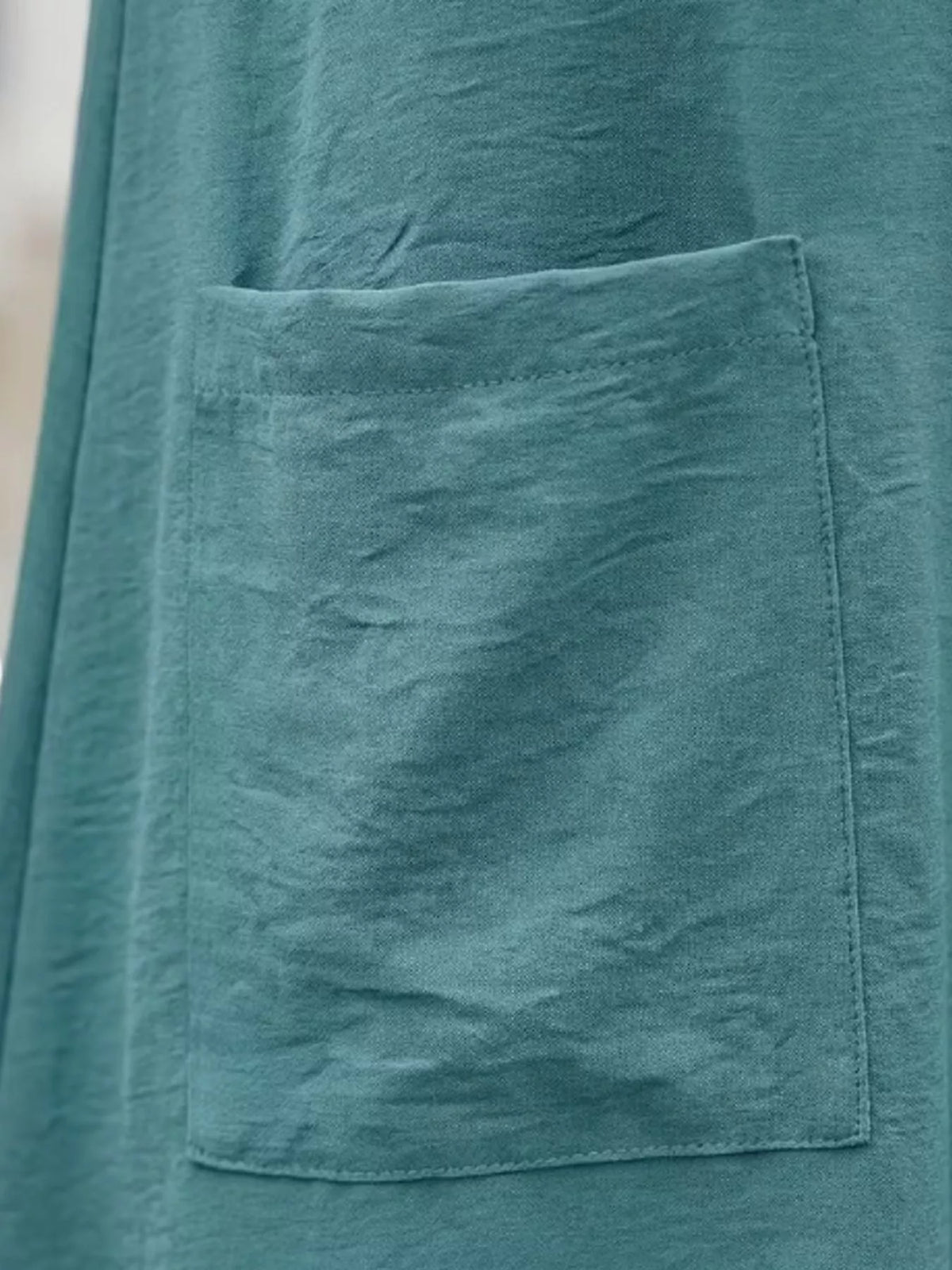 Blue loose fit t-shirt dress with pockets, detail view
