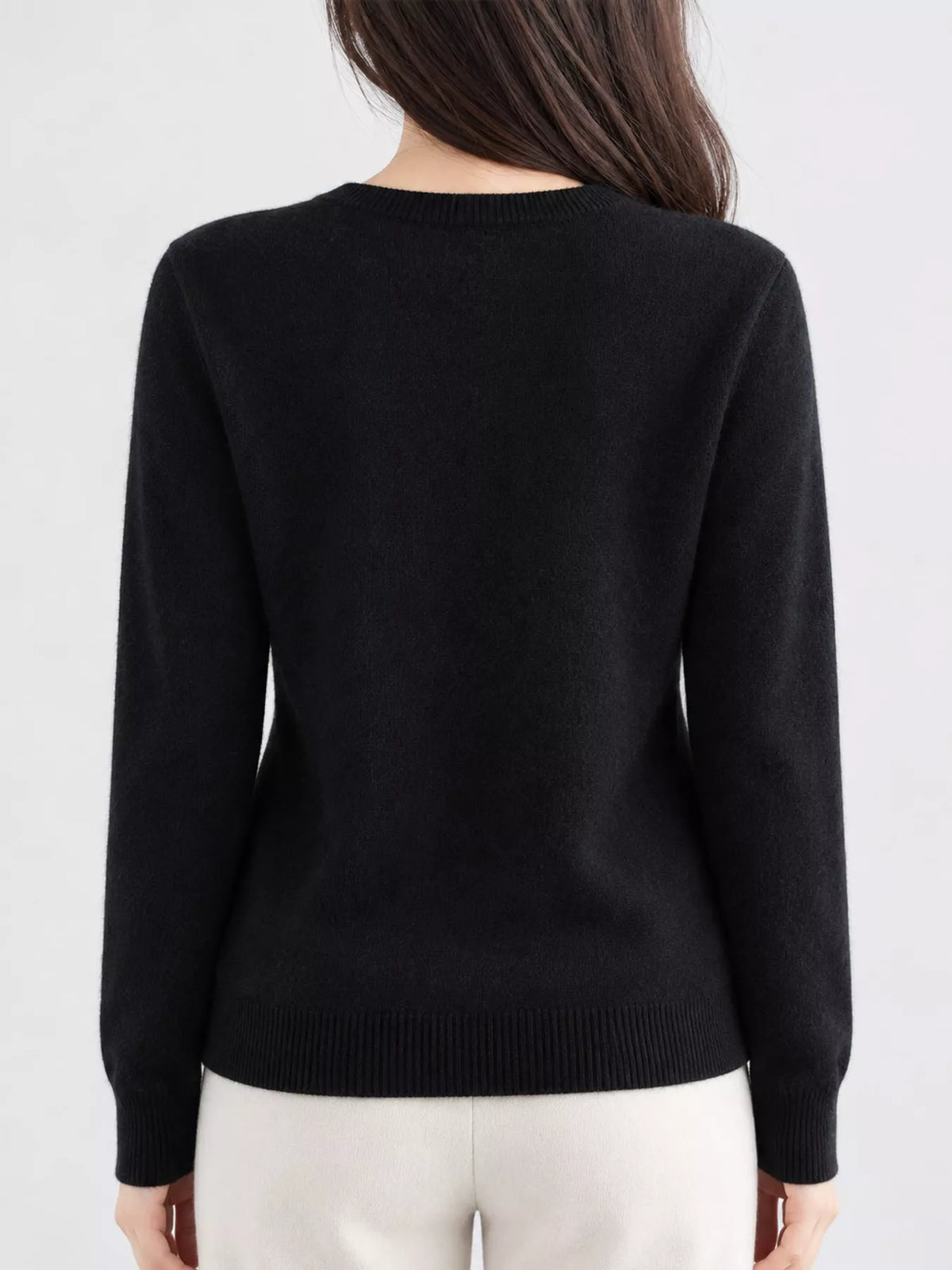 Black crew neck button-front cardigan, back view