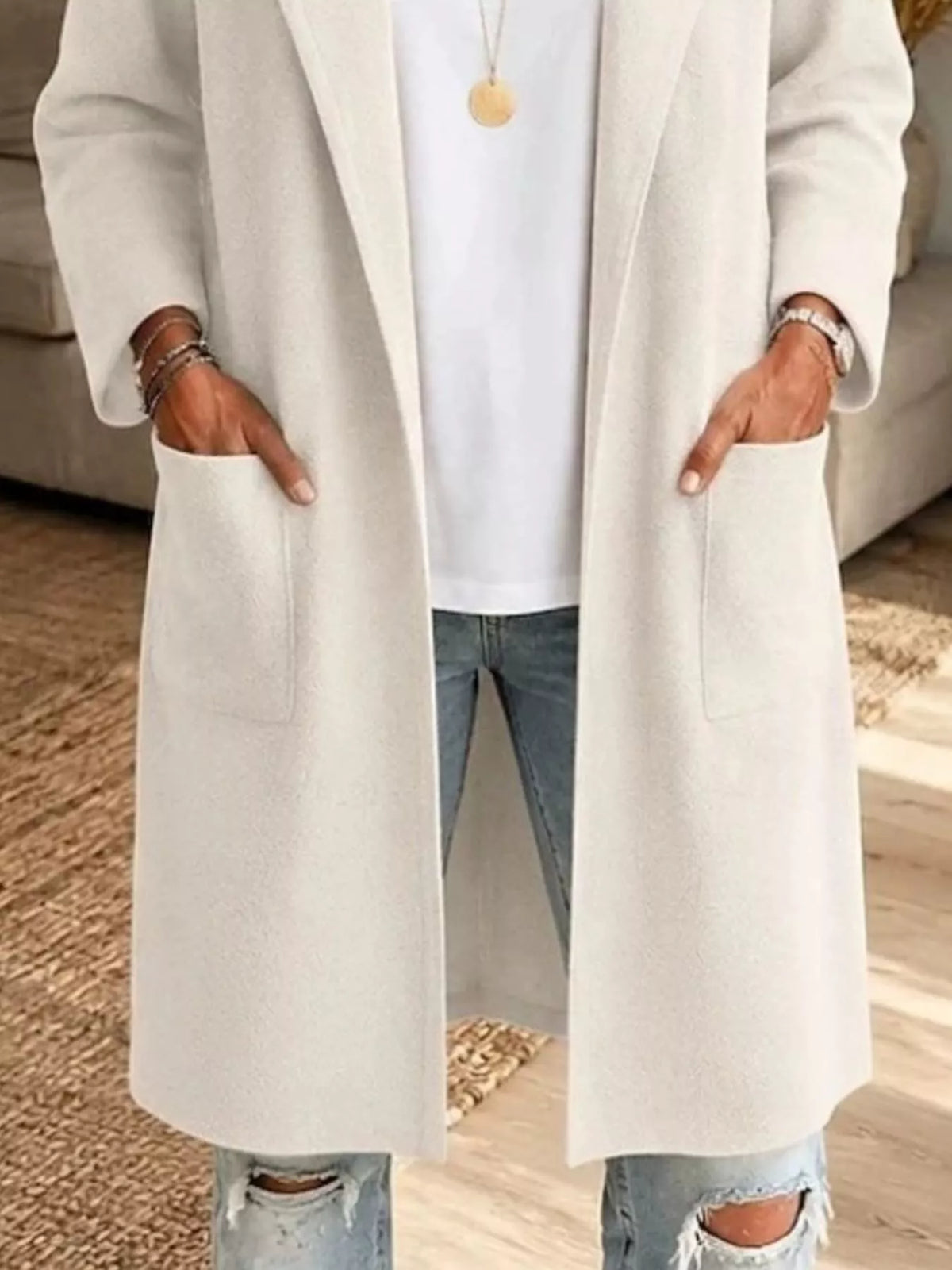 White open-front longline knit cardigan, open front, patch pockets, and long hem