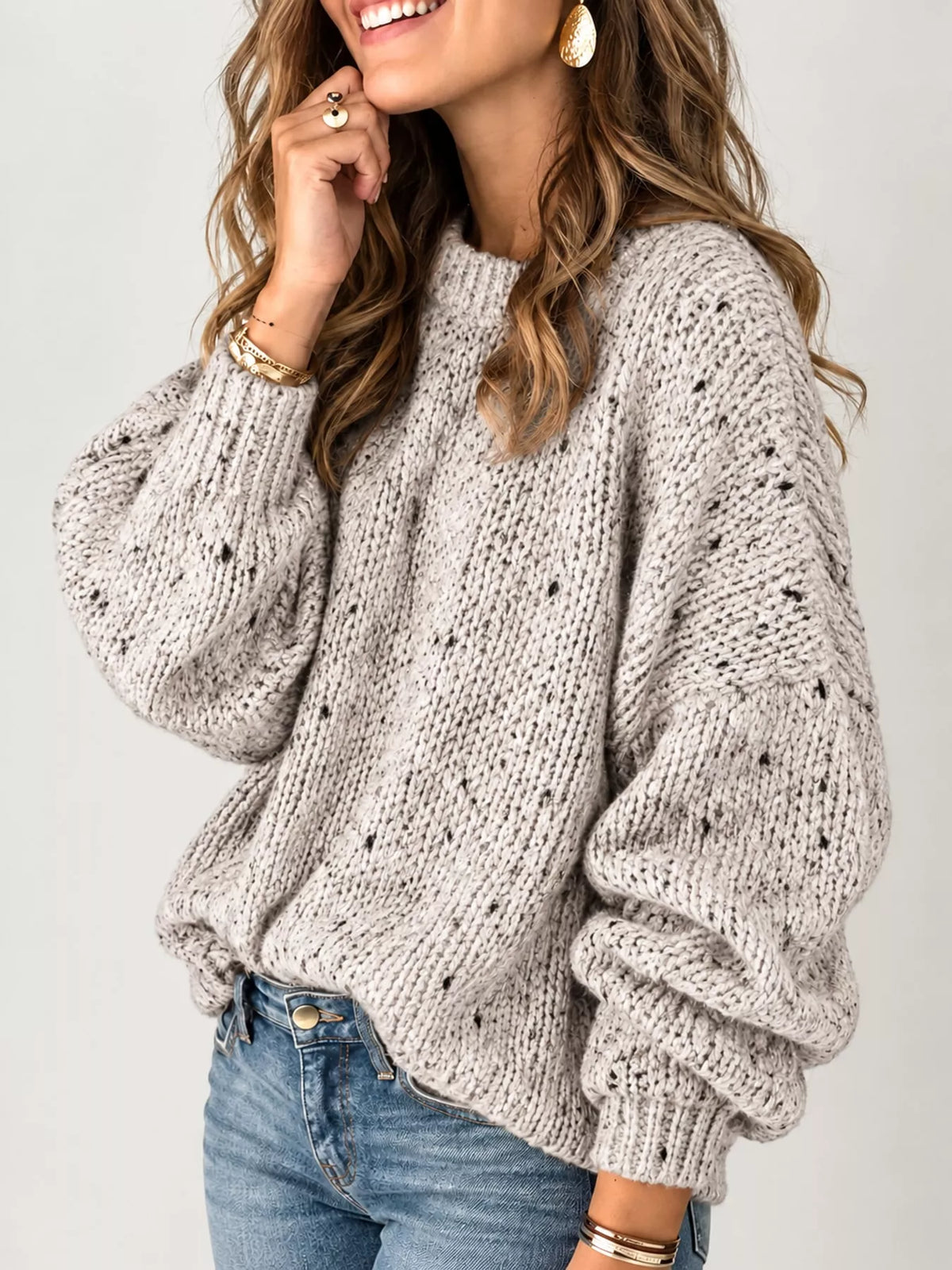 Beige chunky knit round neck sweater, side view