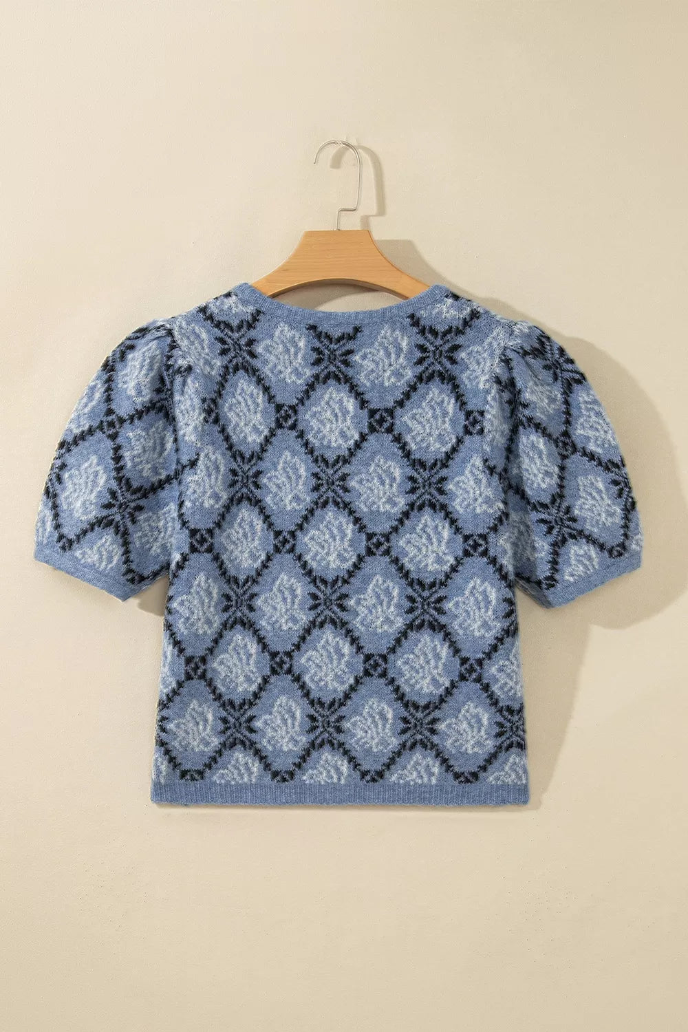 Blue geometric short sleeve cardigan, back on hanger