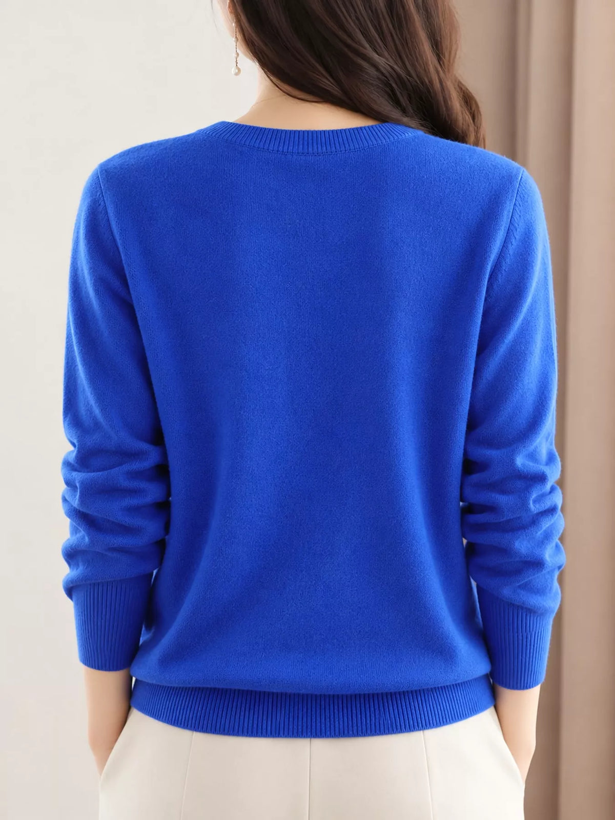 Royal blue crew neck button-front cardigan, back view