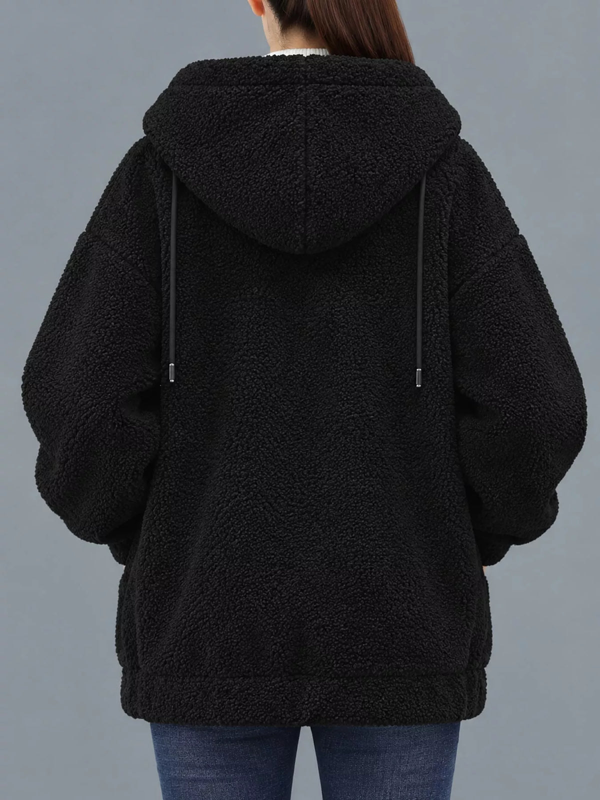 Black fleece zip-up hoodie with pockets, back view