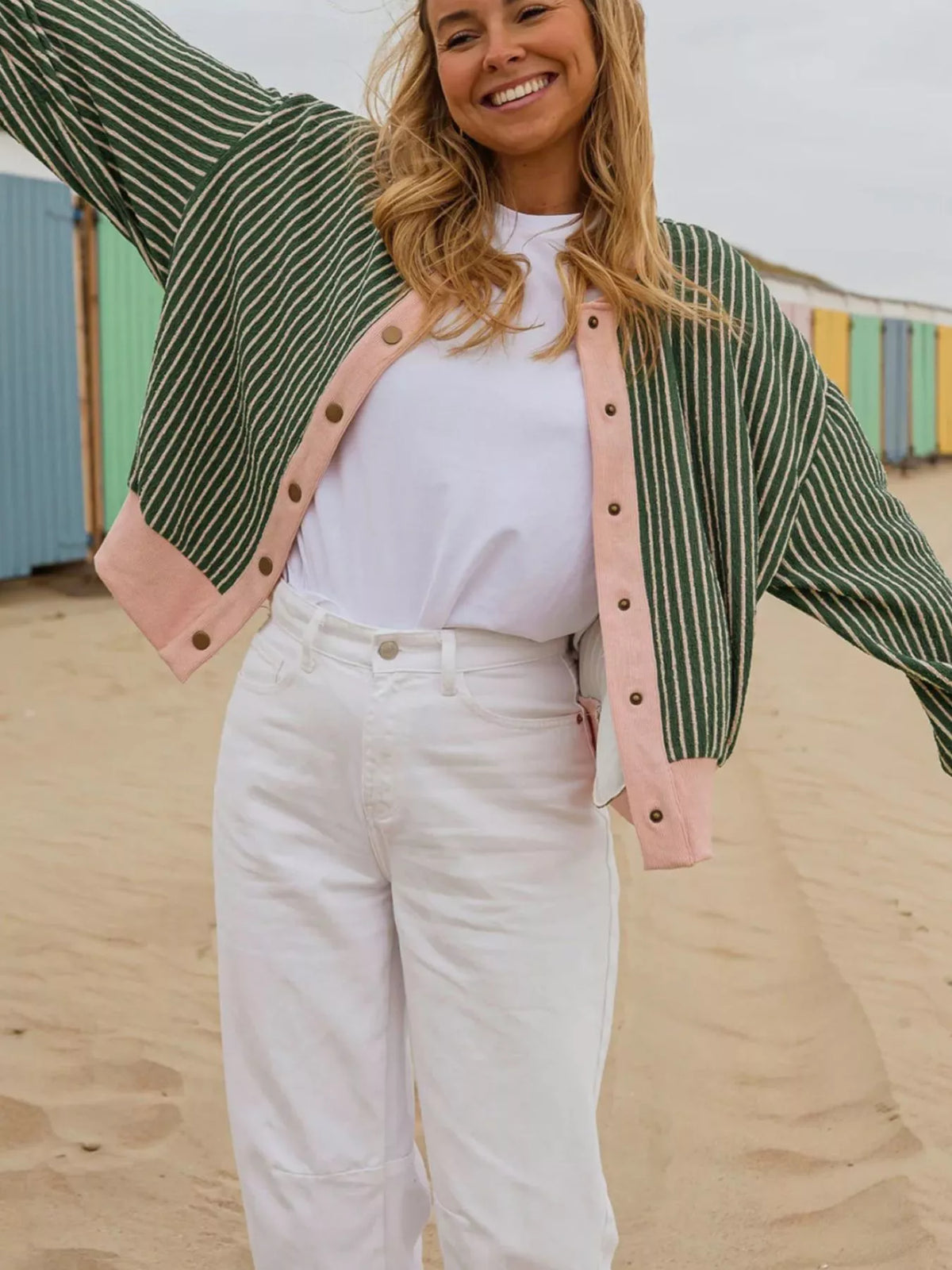Green and pink striped striped round neck patchwork cardigan — front view