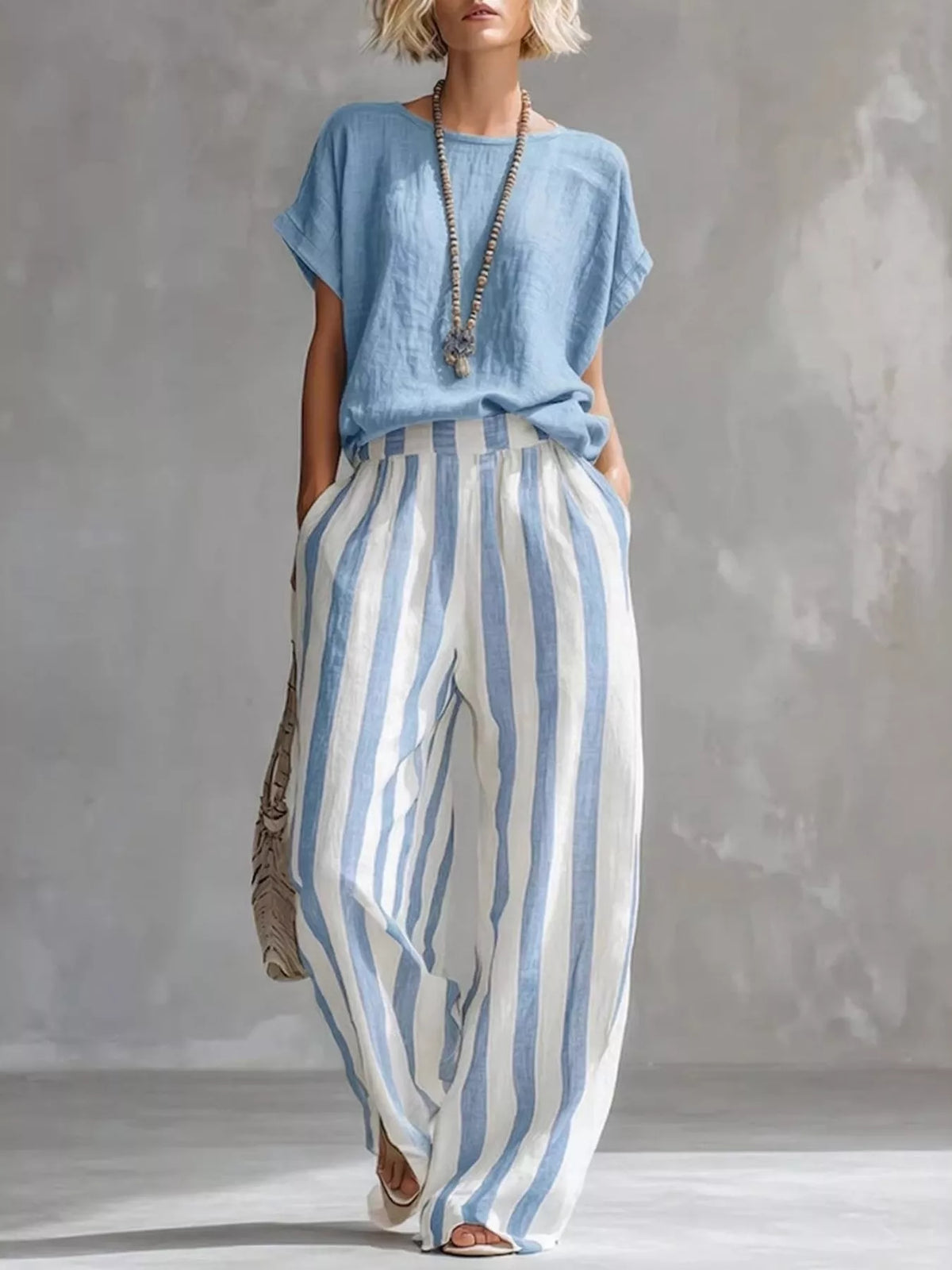 Light blue short sleeve top and wide-leg pants set — front view