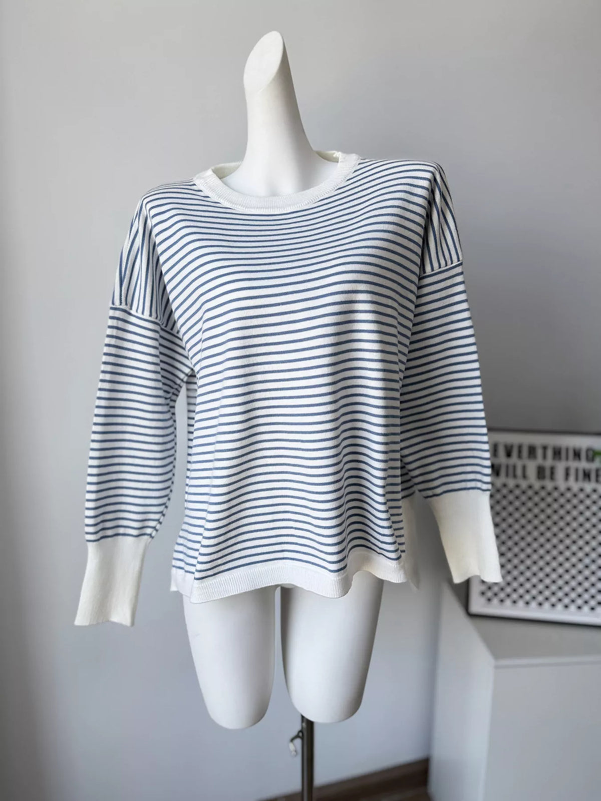Striped round-neck knit top in white and blue, front mannequin view