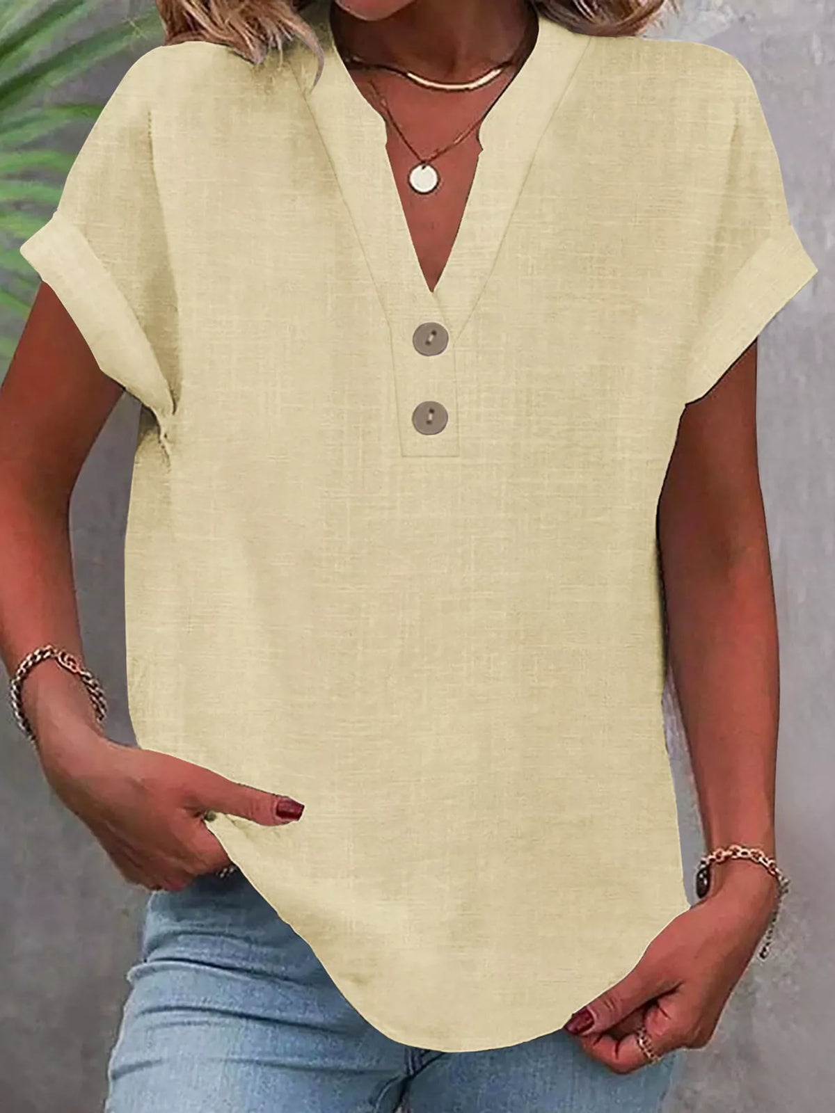 Pale yellow button detail short sleeve blouse, front view
