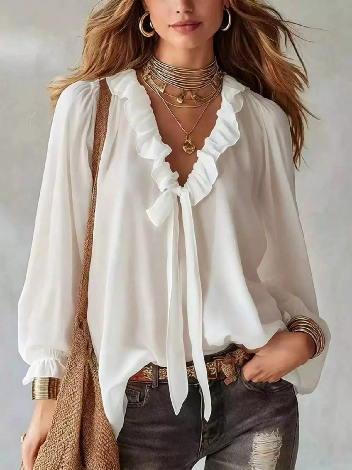 White ruffled v-neck blouse with tie-front detail