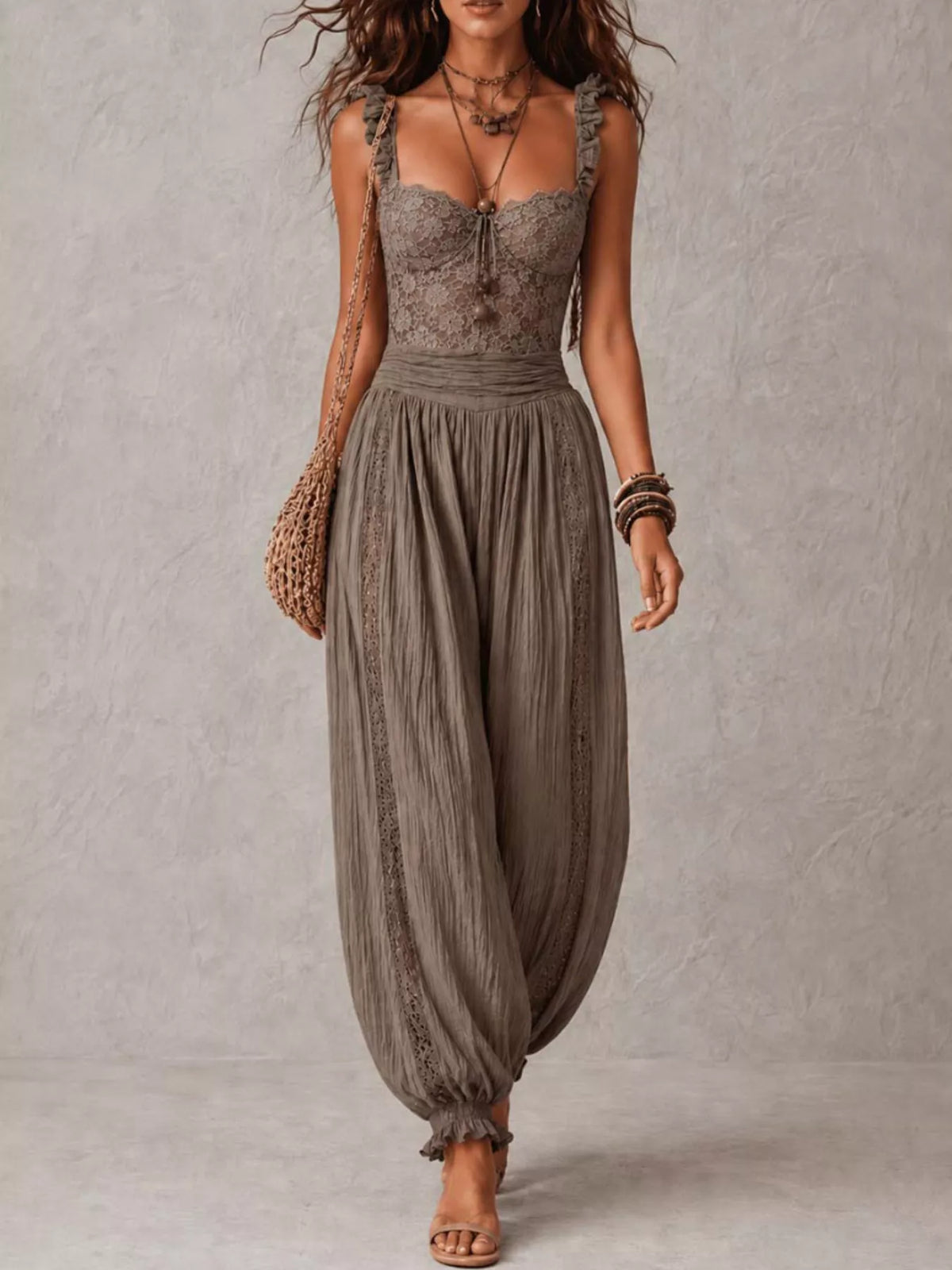 Taupe lace-bodice harem-leg jumpsuit, full front view.