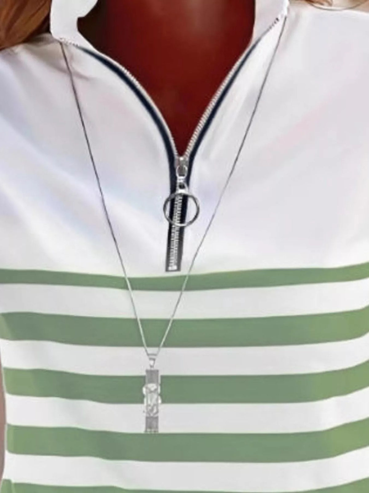 Green and white quarter-zip striped top, neckline detail