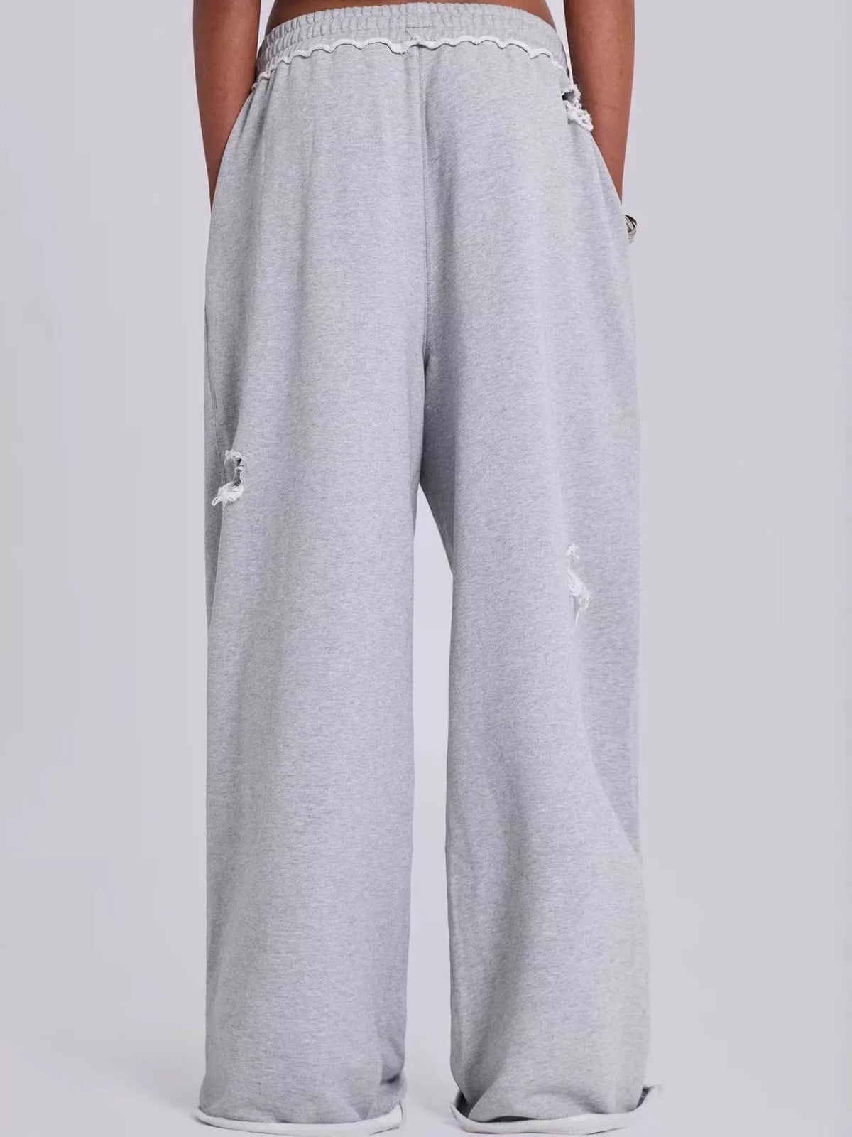 Gray distressed high-waisted wide-leg sweatpants, back view