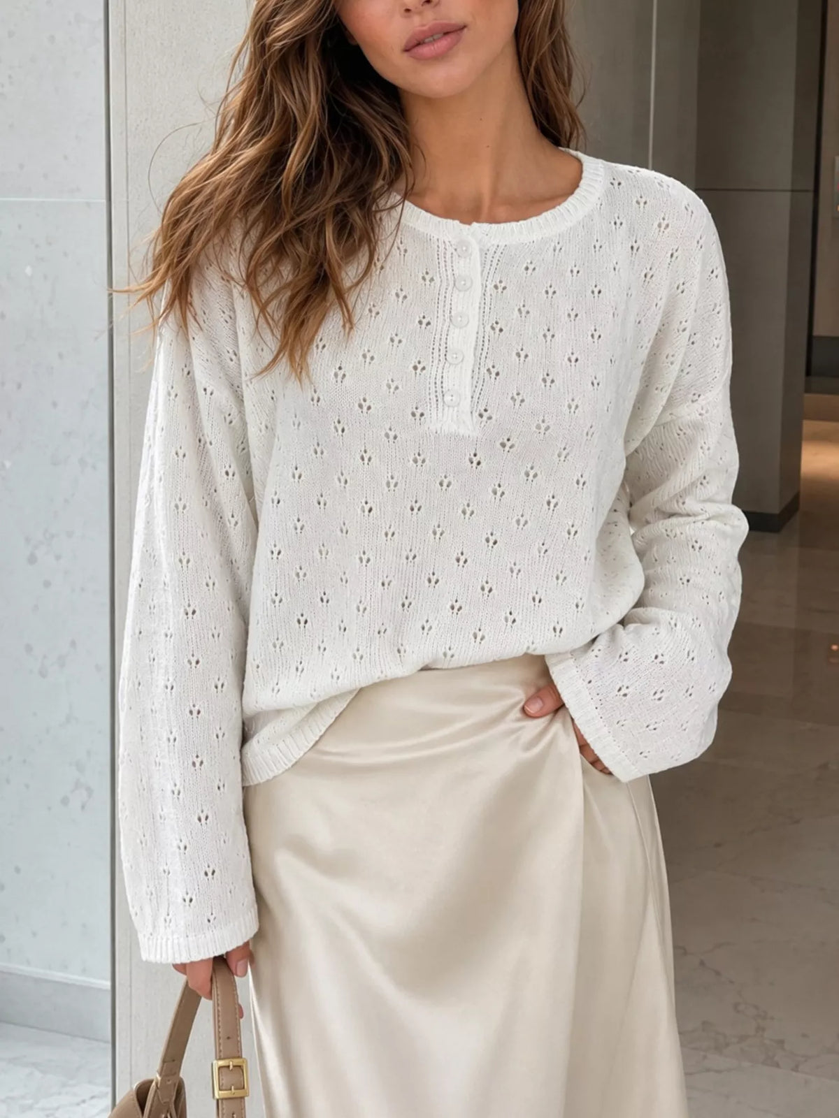 White pointelle round-neck knit top, front view.