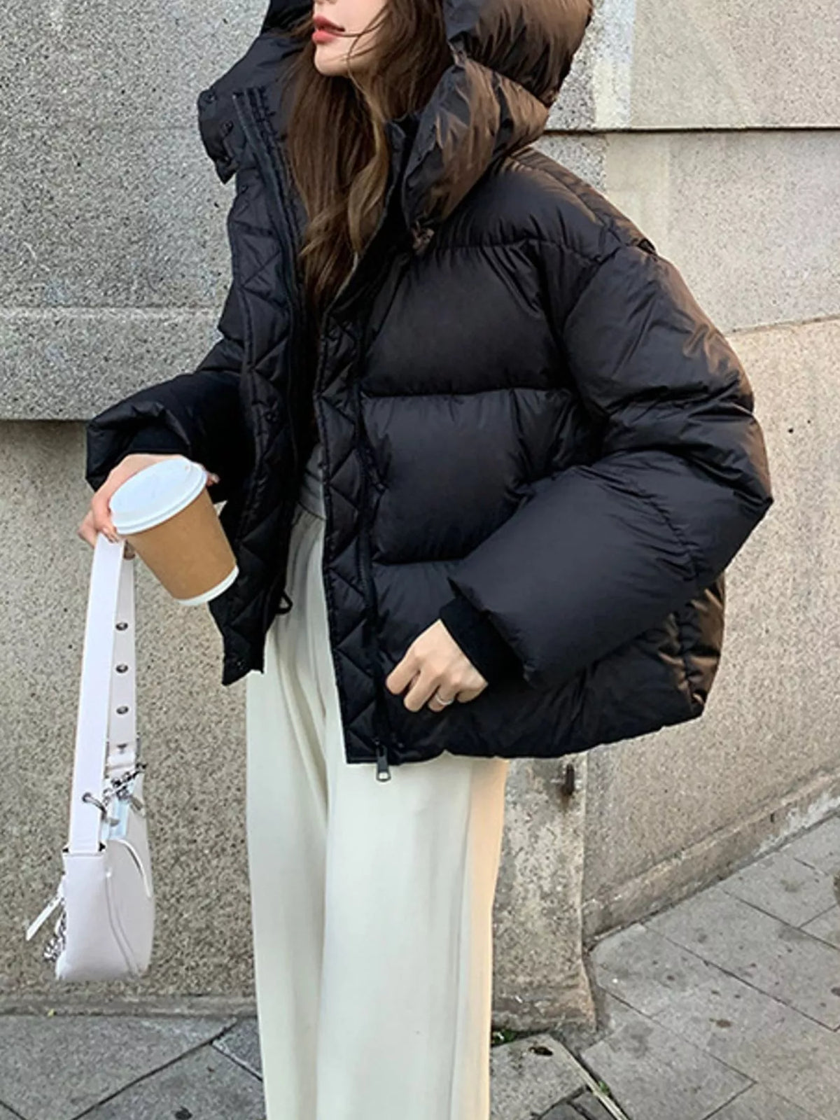 Black quilted hooded puffer jacket, open front view