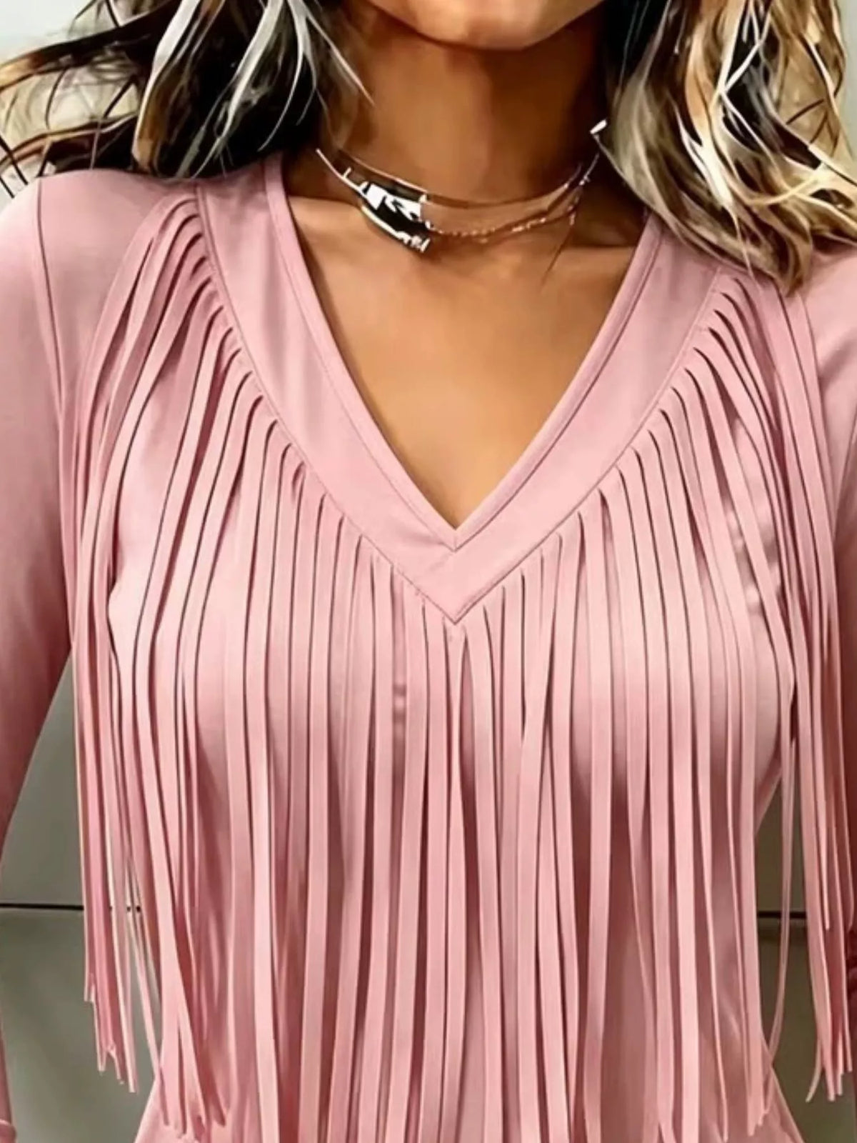 Pink fringe V-neck top, neckline and fringe close-up