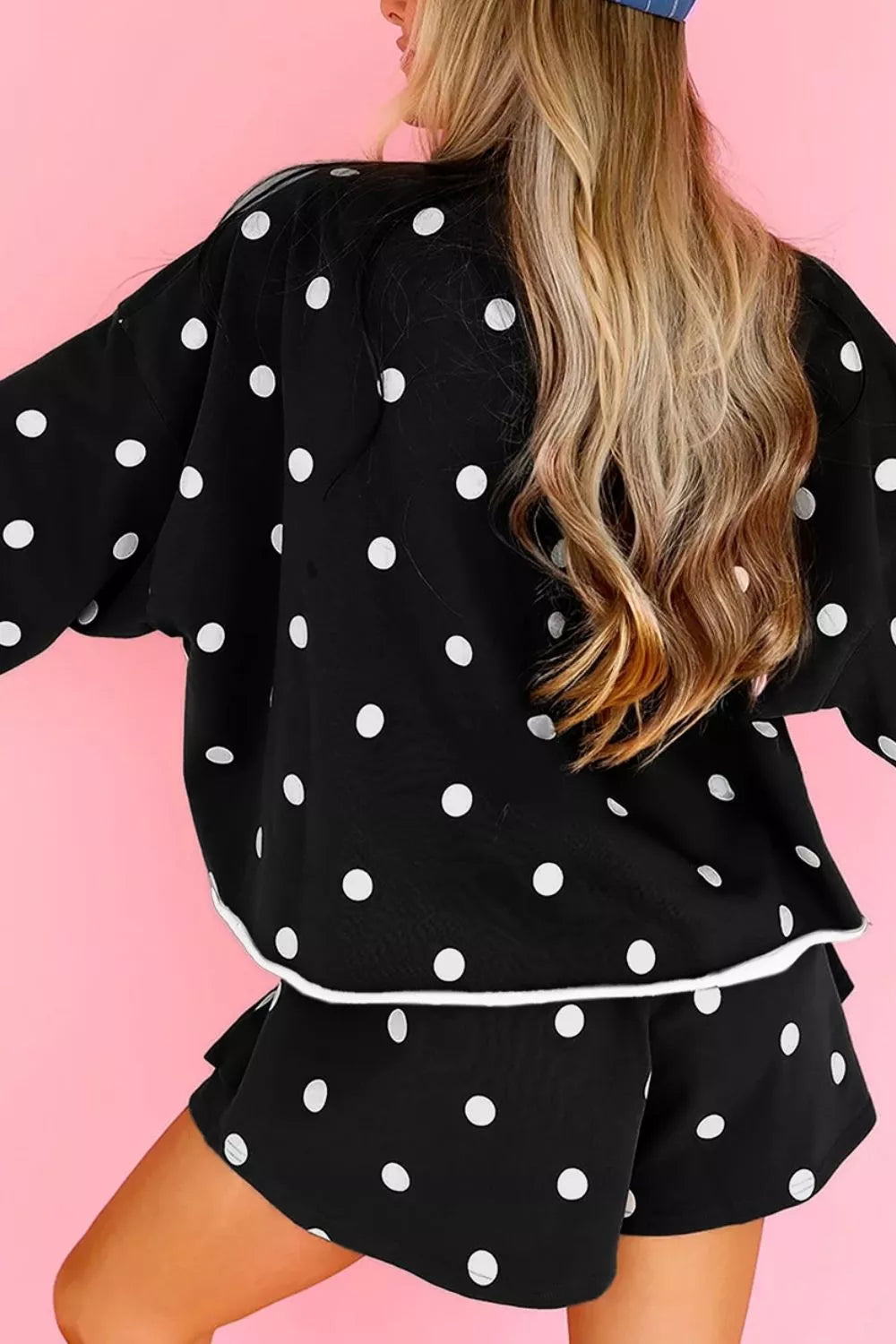 Polka Dot Raw Hem Pullover and Skort Set in black, back view