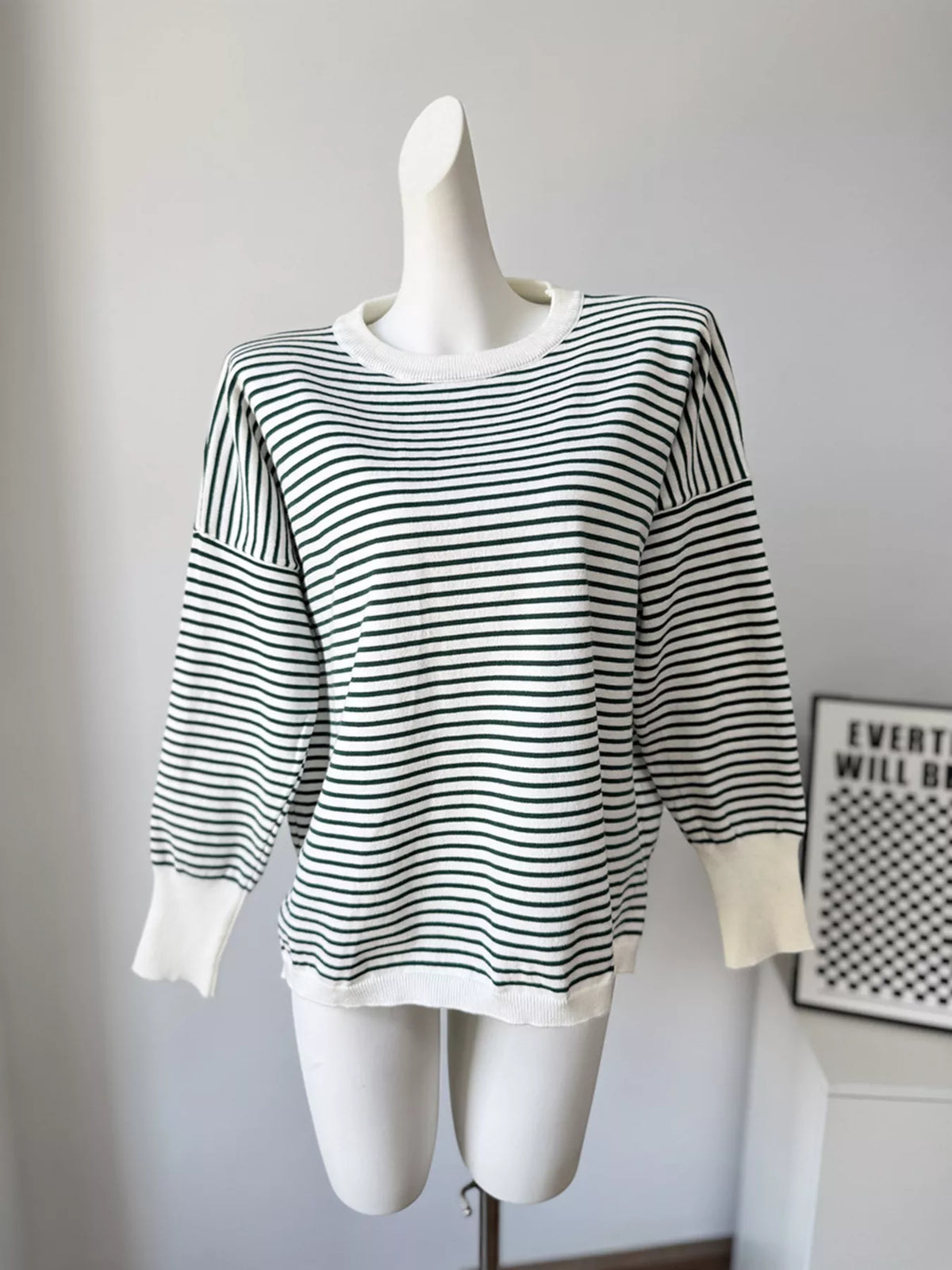 Striped round-neck knit top in white and green, front mannequin view