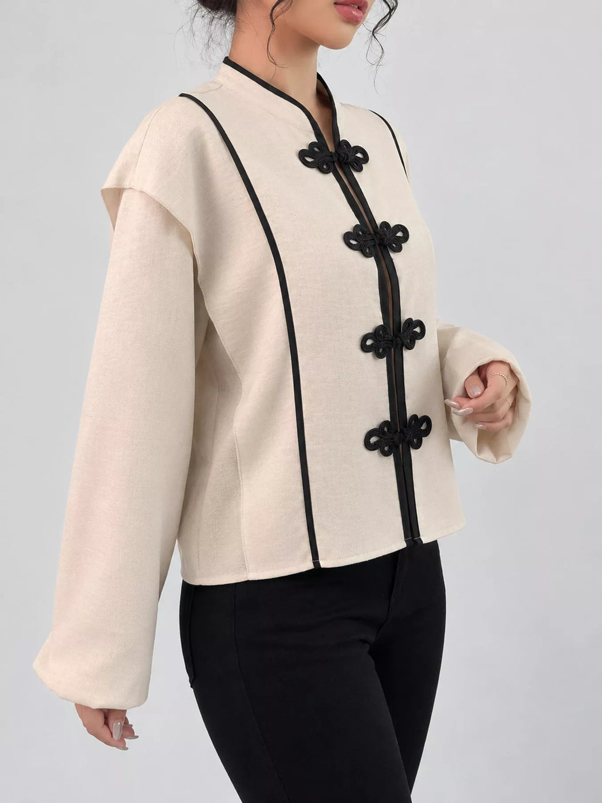 Cream chinese-style mandarin collar blouse, side view
