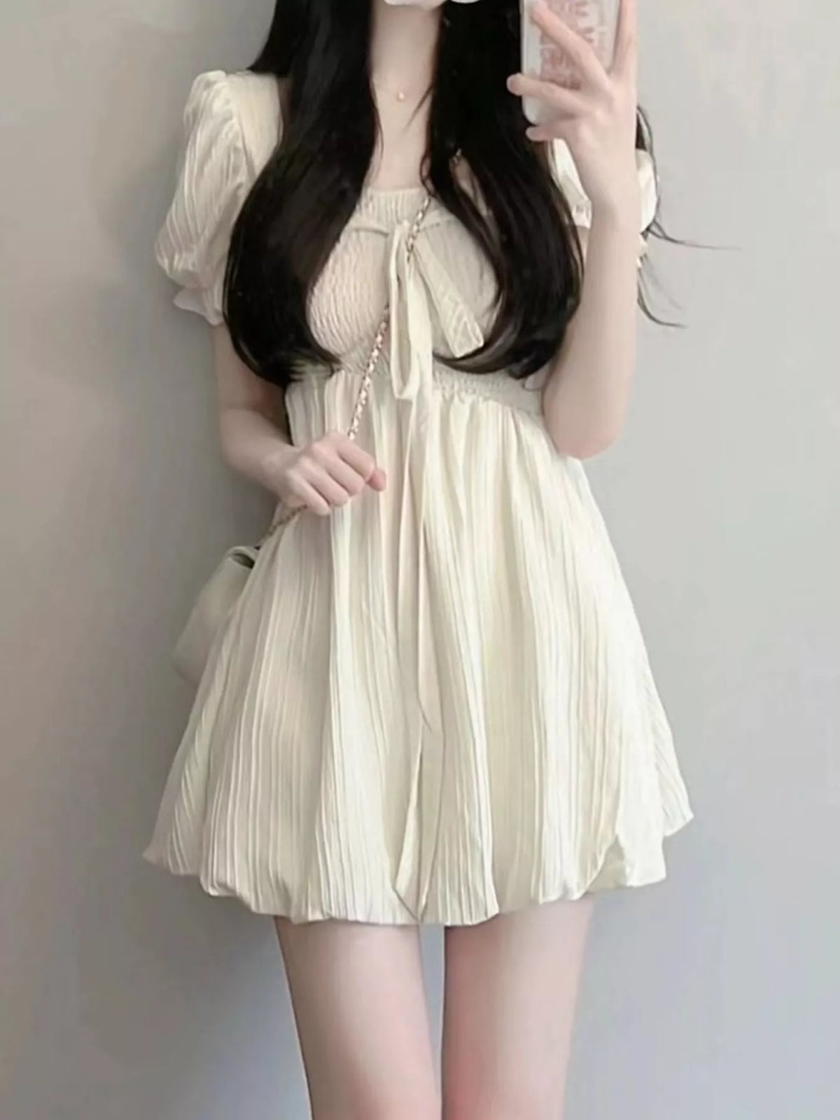 Cream puff-sleeve smocked mini dress with tie-front detail