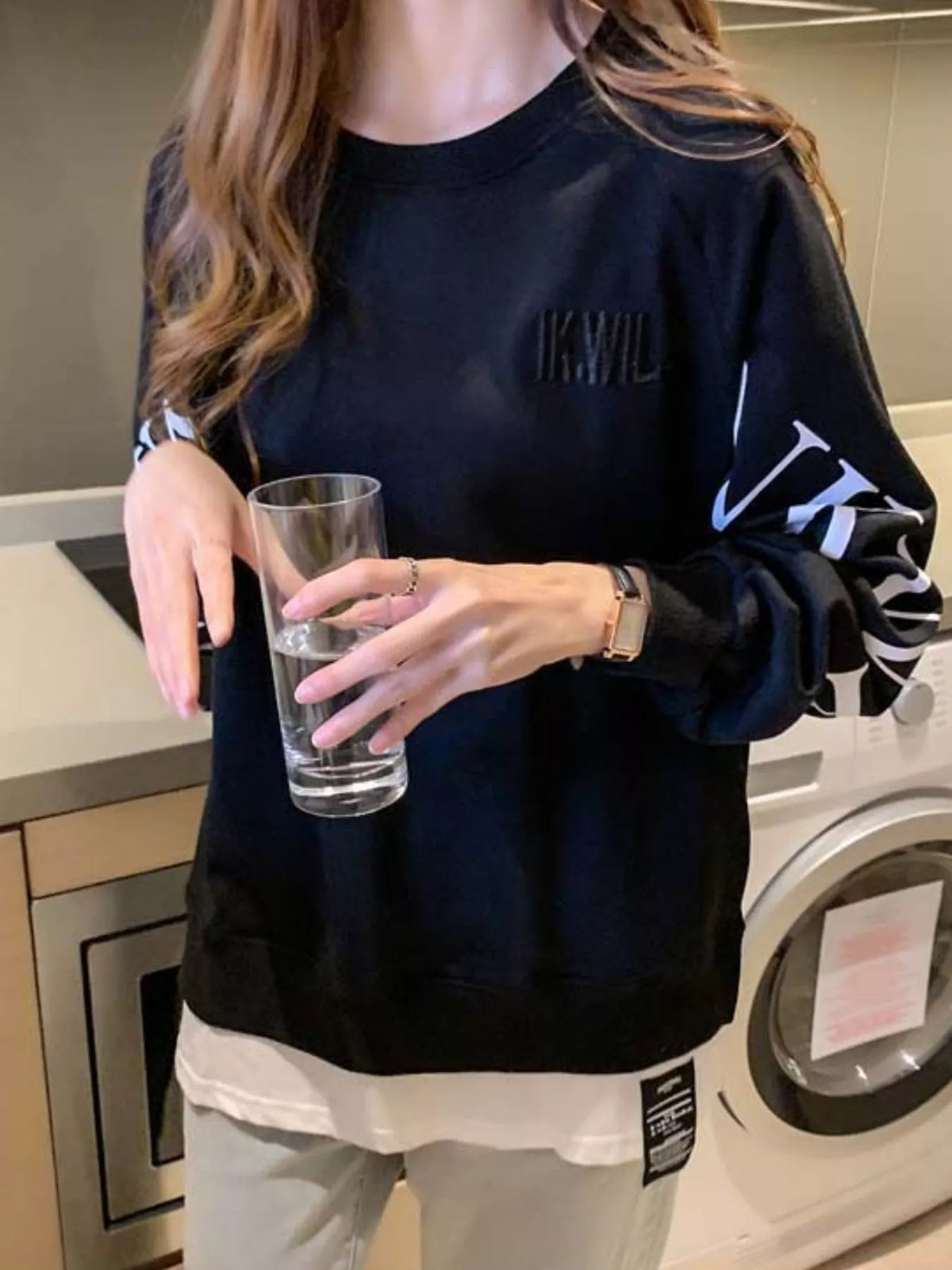 Black layered-hem sweatshirt with graphic sleeve detail