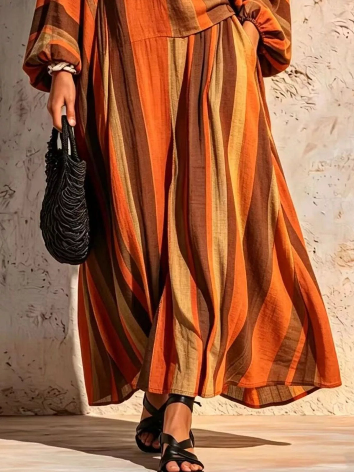 Orange and brown striped v-neck top and wide-leg pants set, wide-leg pants detail.