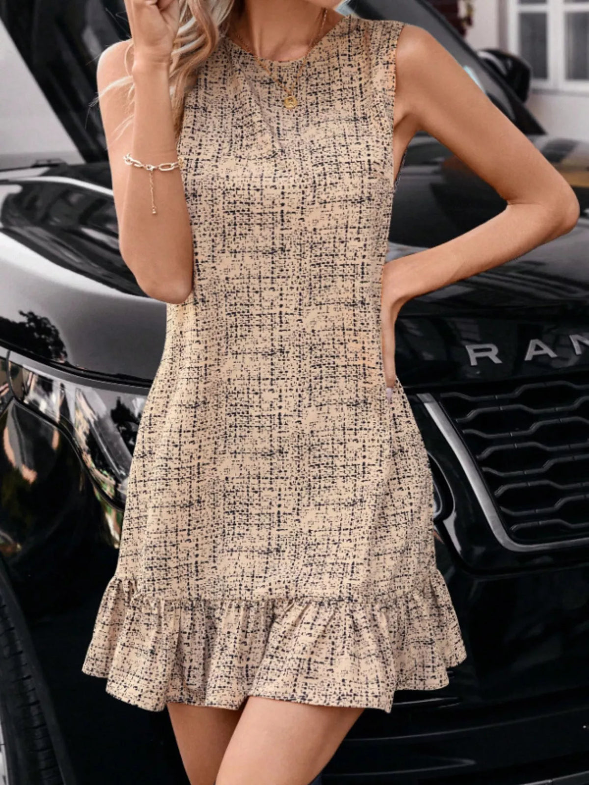 Tan tweed sleeveless ruffle hem mini dress
