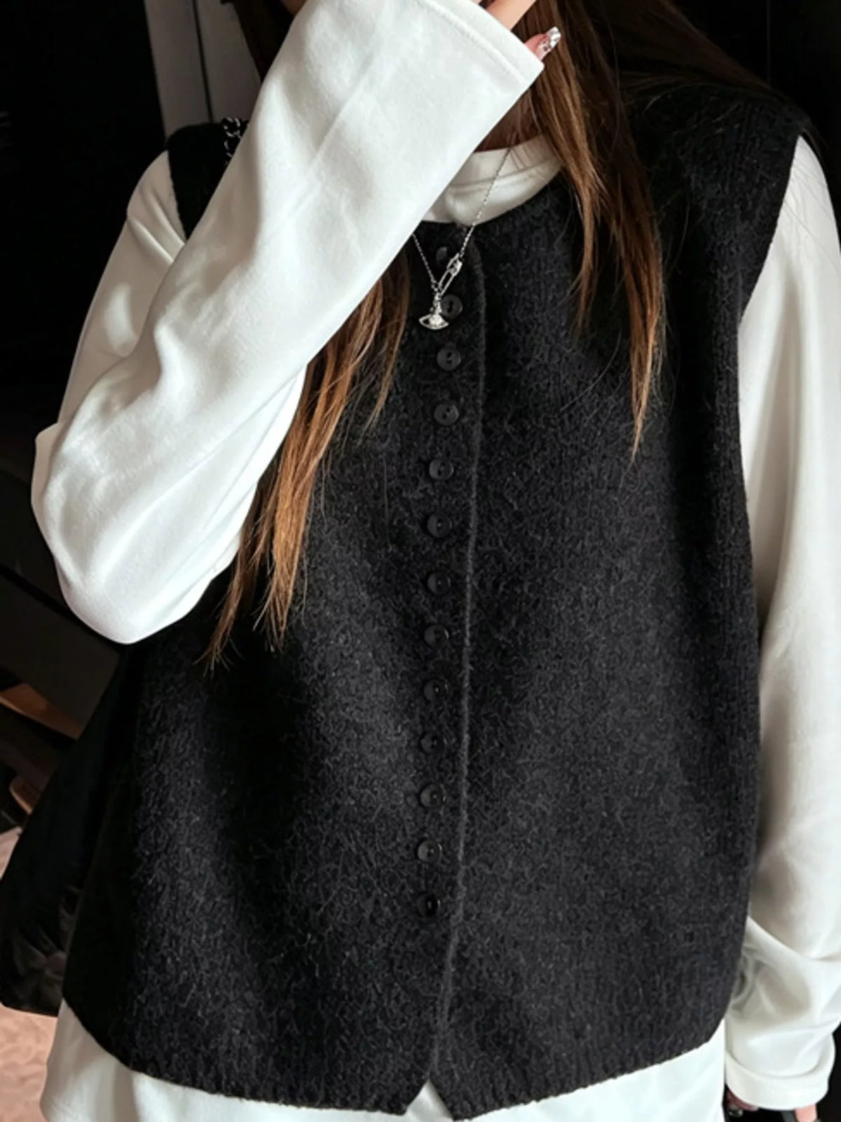 Black sleeveless sweater vest