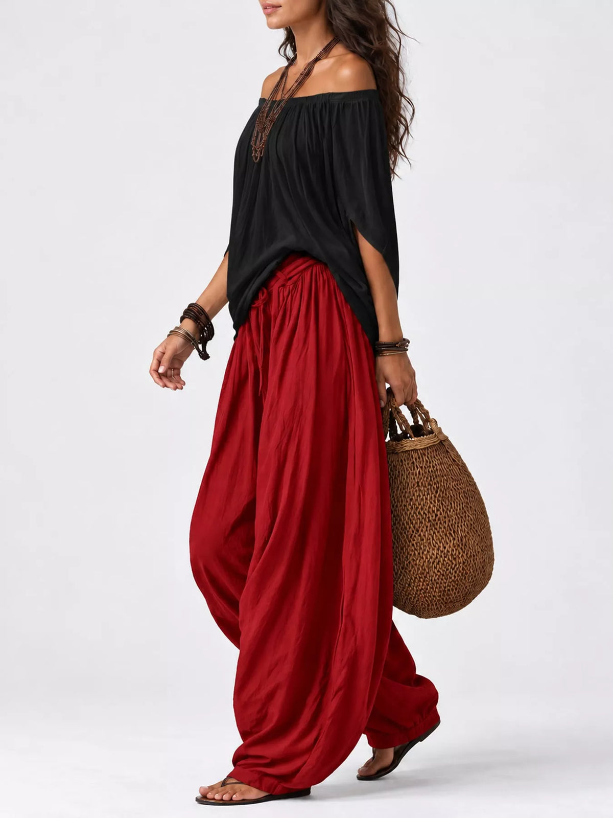 Black top and red pants off-shoulder top and wide-leg harem pants set — side view