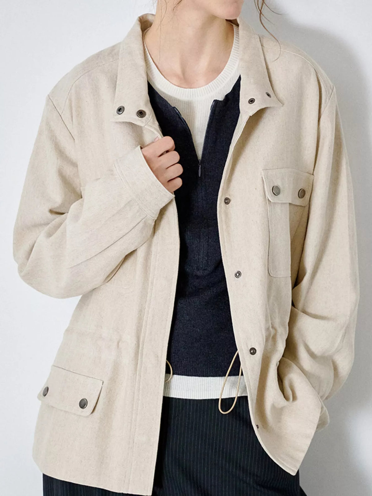 Drawstring utility jacket, ivory front snap detail