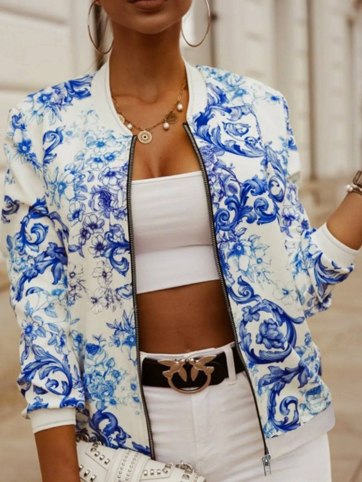 Blue and white scroll printed zip-up bomber jacket — front view