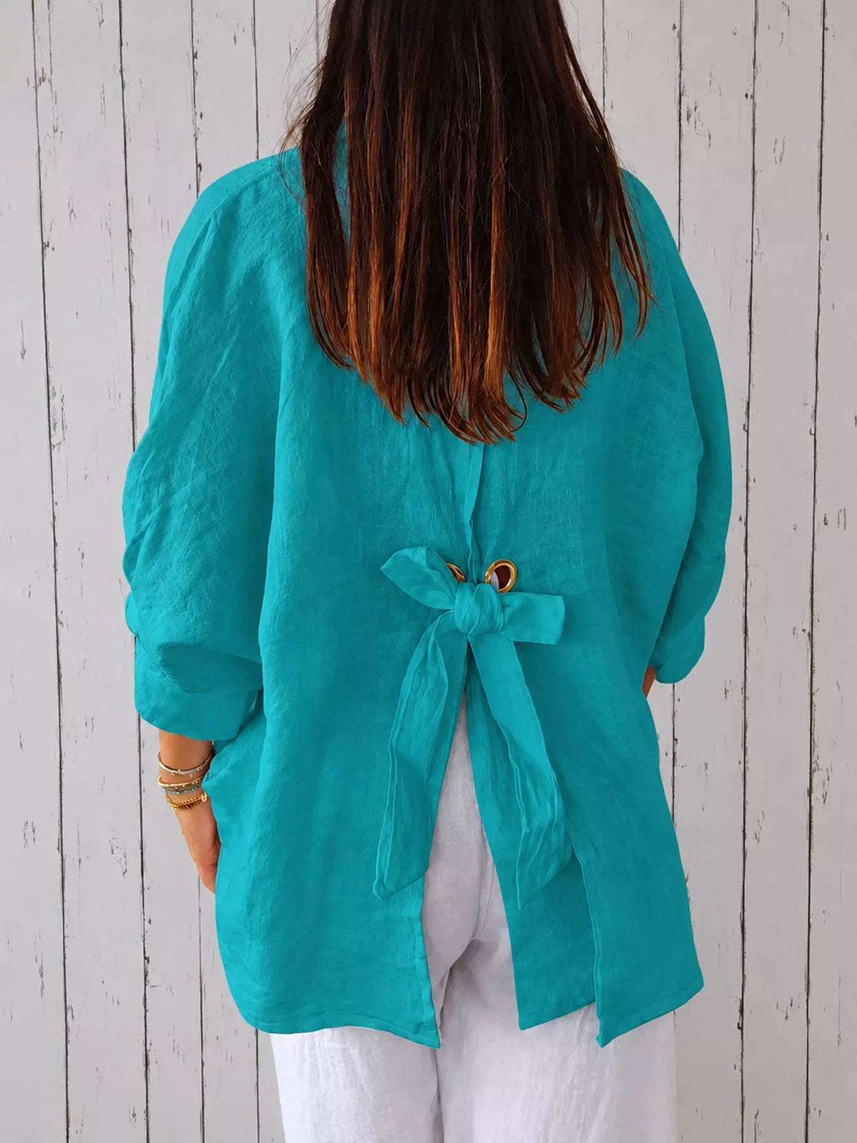 Teal loose fit tie back shirt, back view