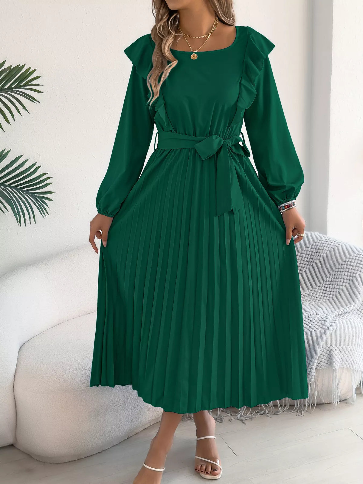 Green ruffled pleated tie-waist midi dress, front showing pleated skirt.